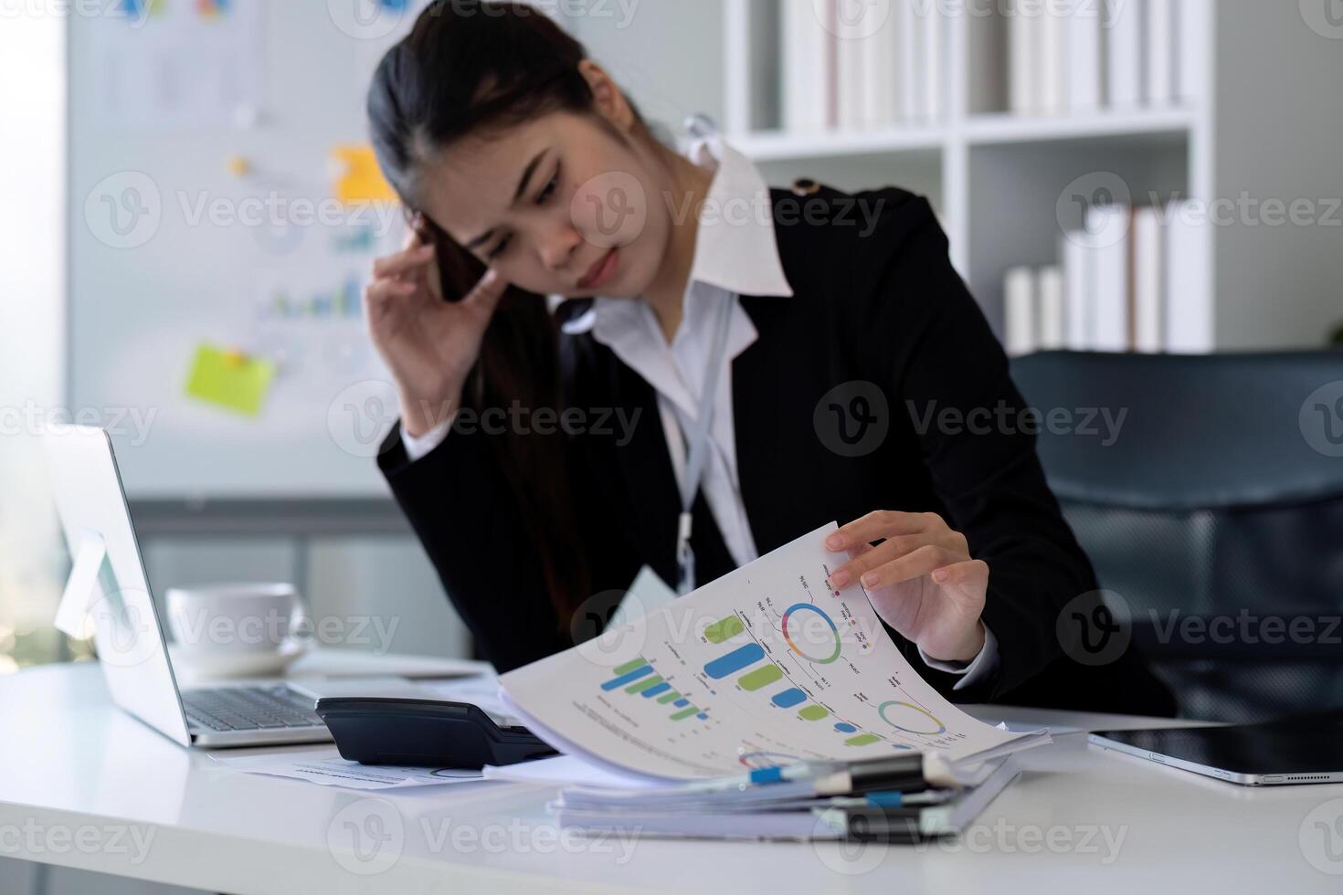 Business woman feeling tired from working in the office photo
