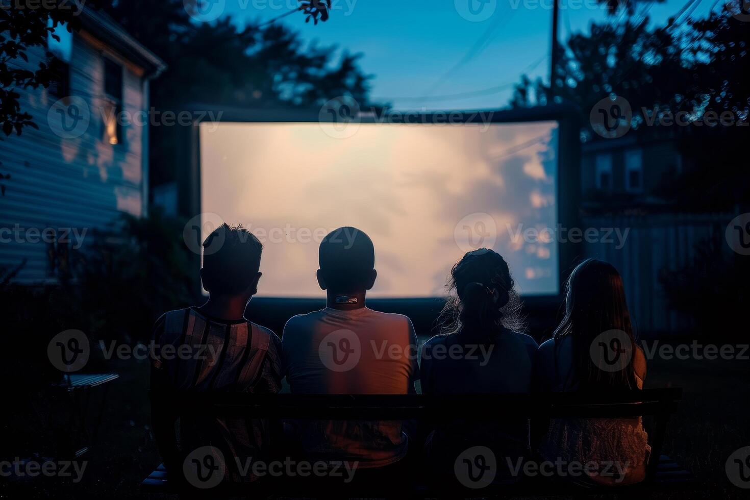 people are sitting in lawn chairs in front of a large screen photo