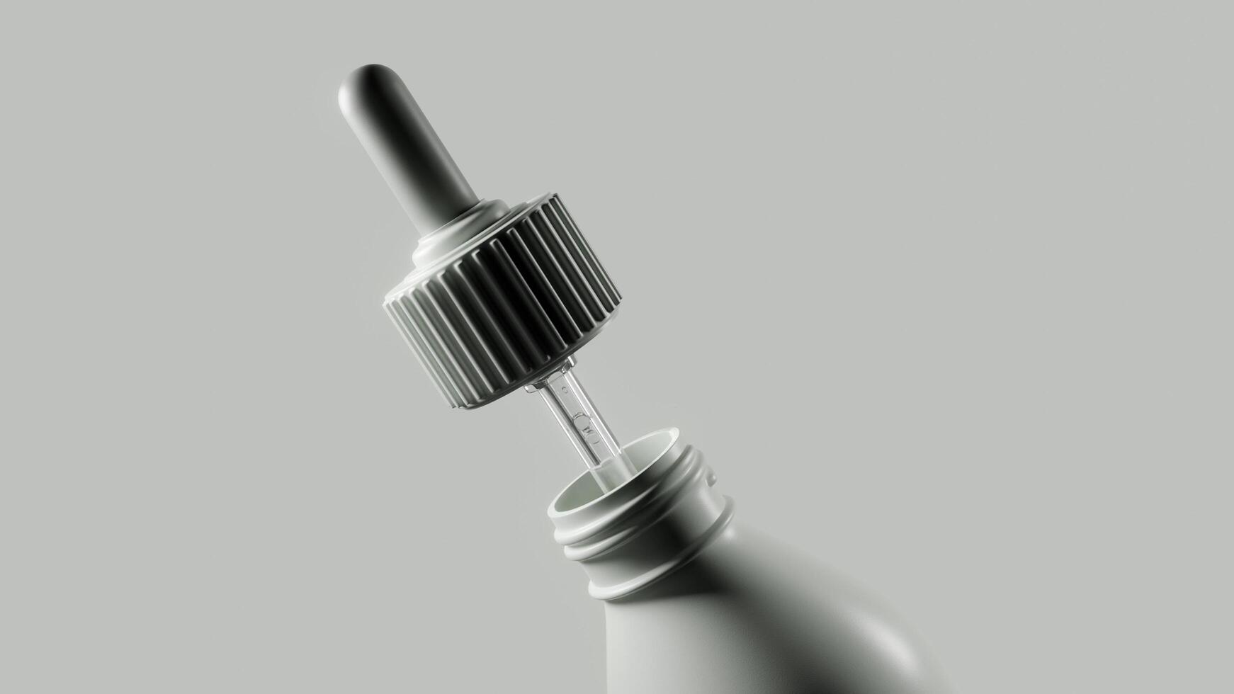 a bottle with a eyedropper in it photo