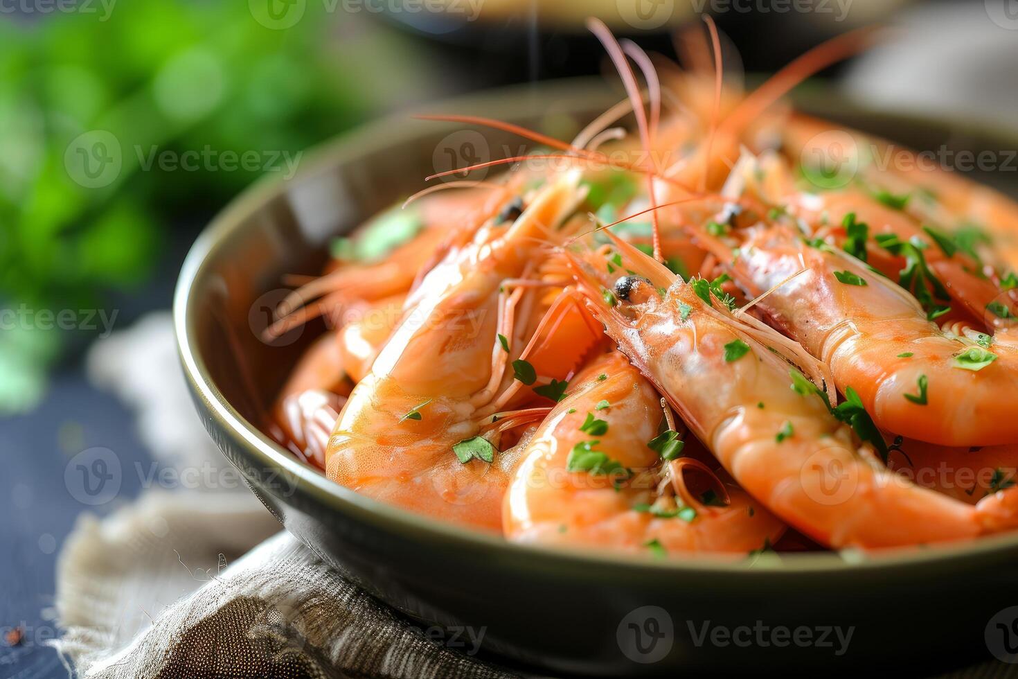 Fresh cooked prawns with herbs in bowl photo