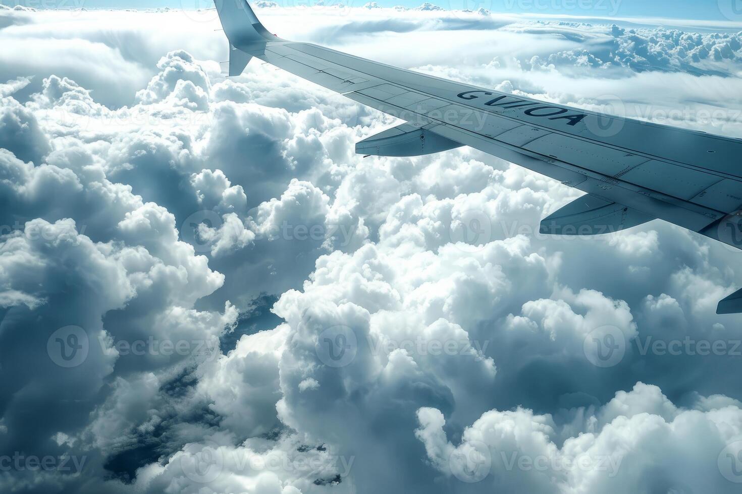 Majestic view from airplane window above clouds photo