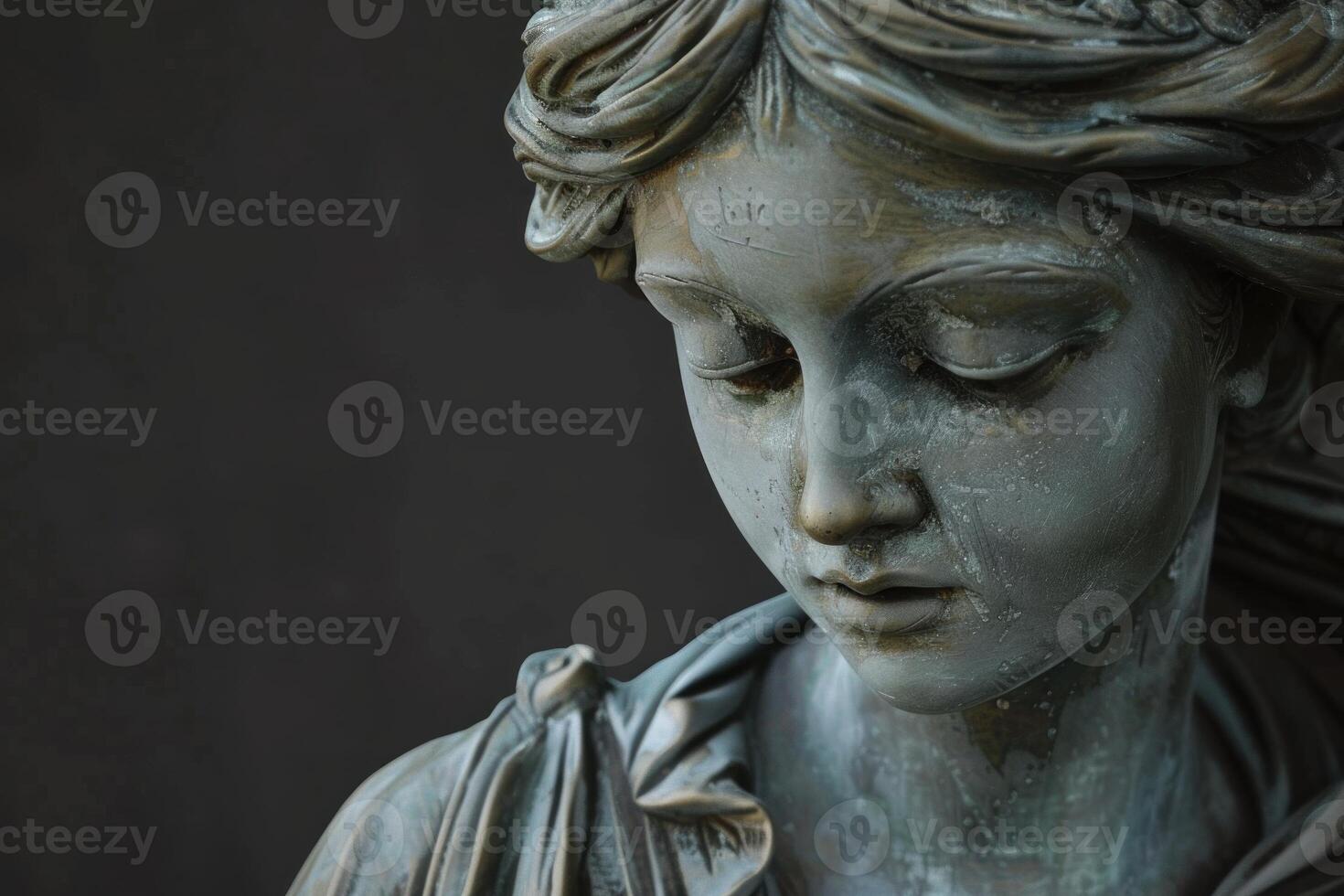 Elegant bronze statue of a woman in thought photo