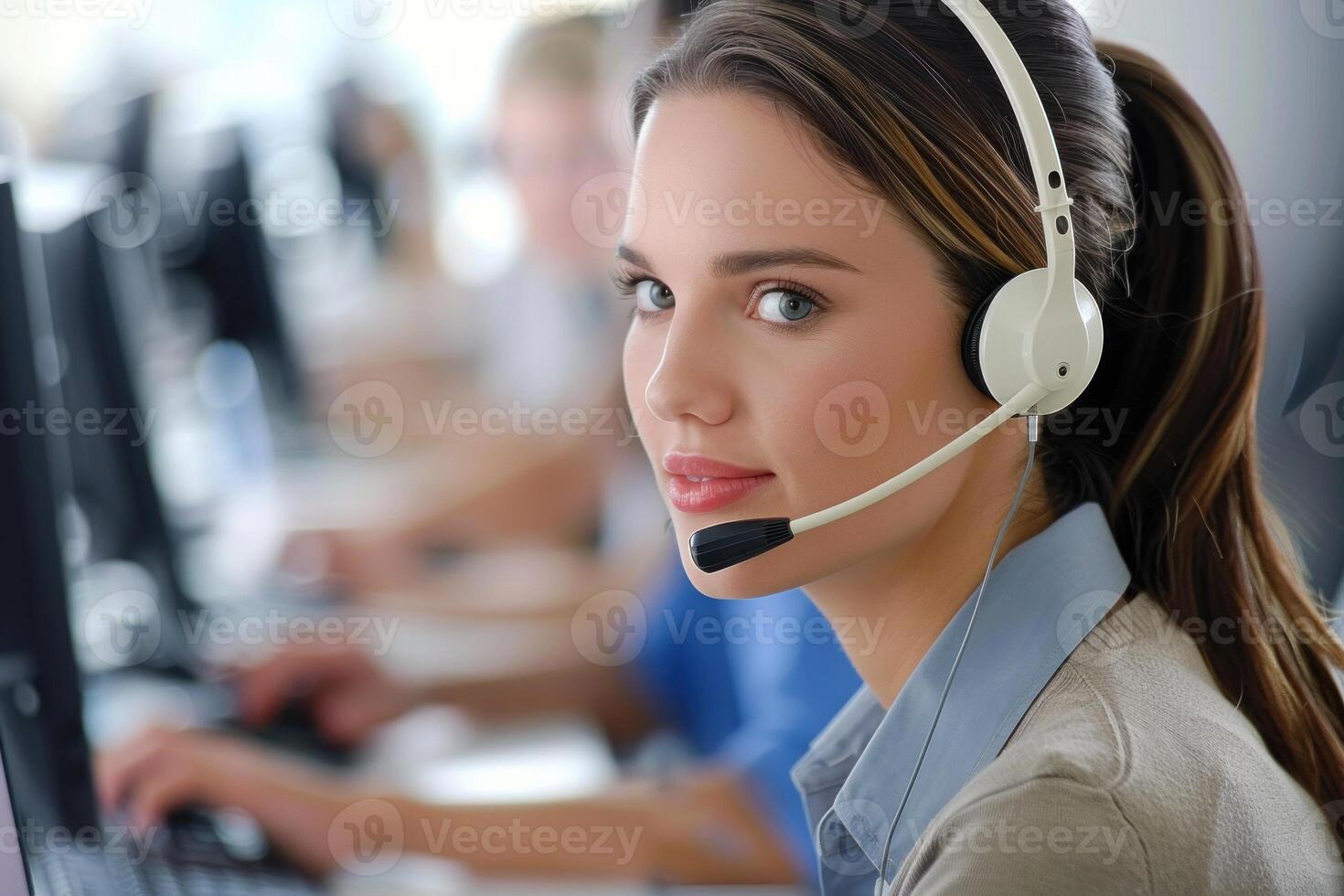 Customer service representative working in busy call center office photo