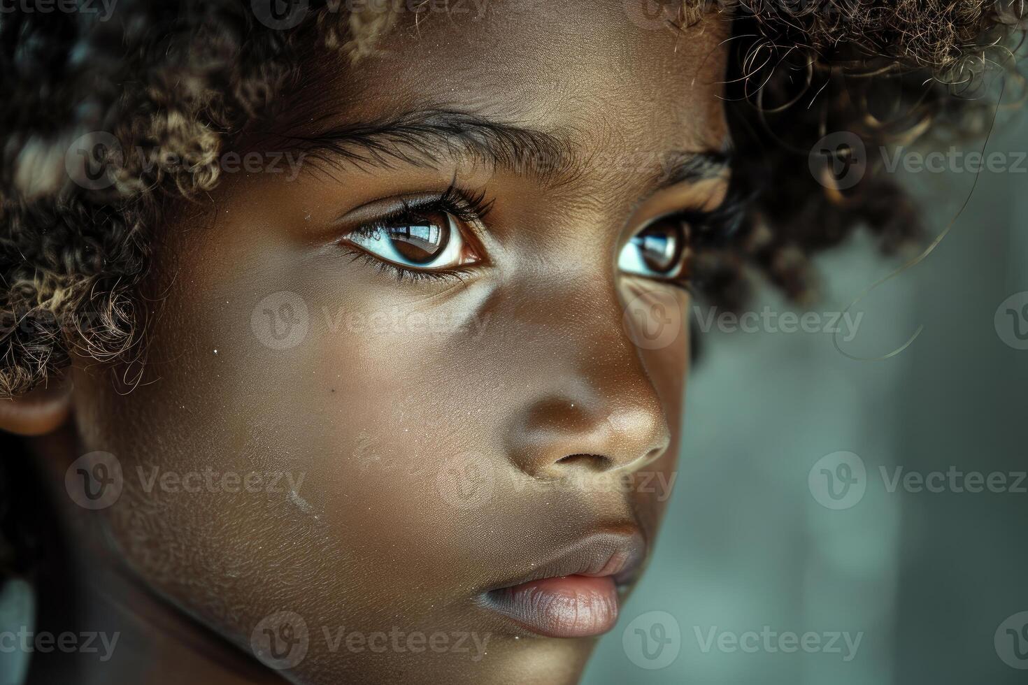 Portrait of a thoughtful child with expressive eyes photo