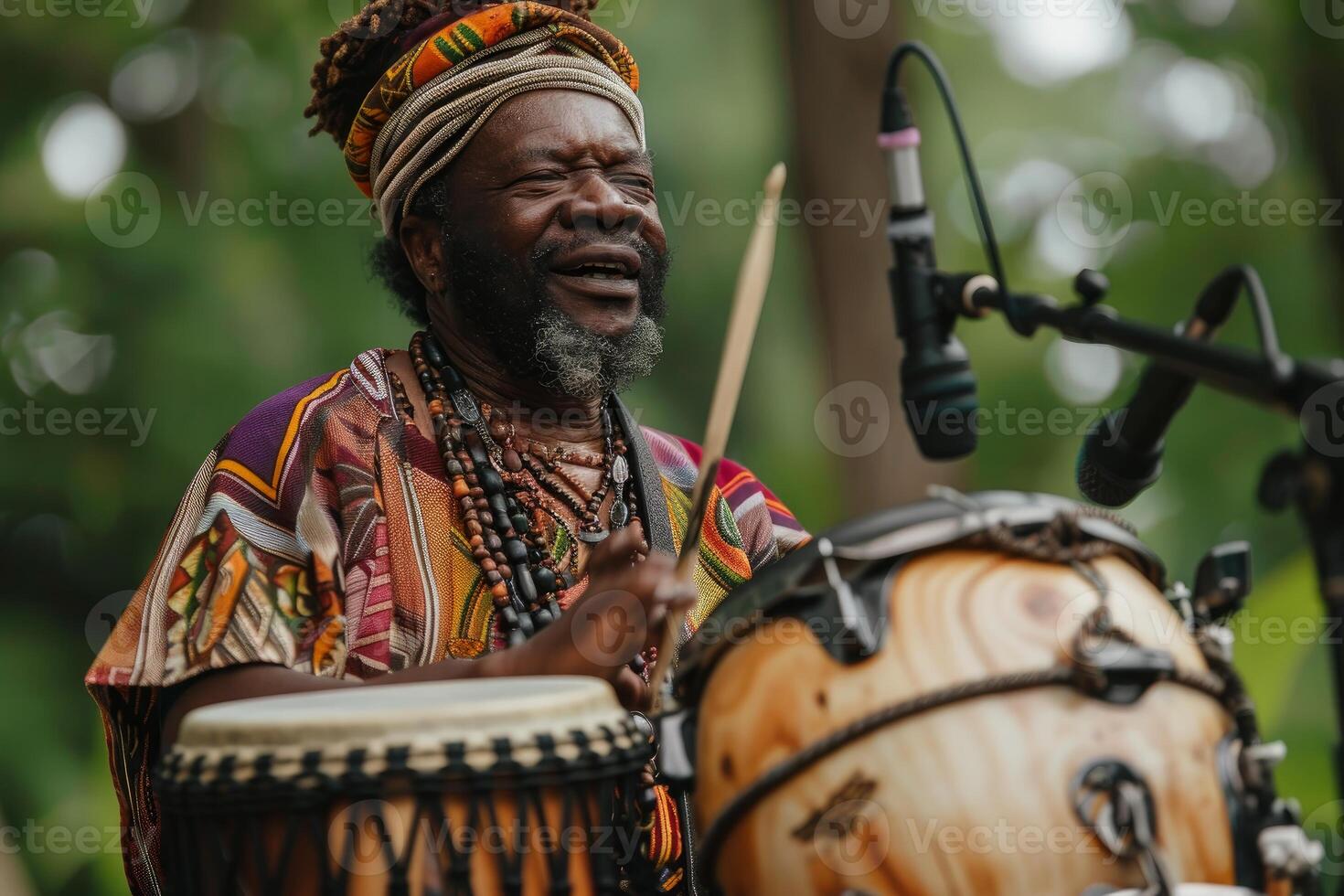 African drummer performing traditional music photo