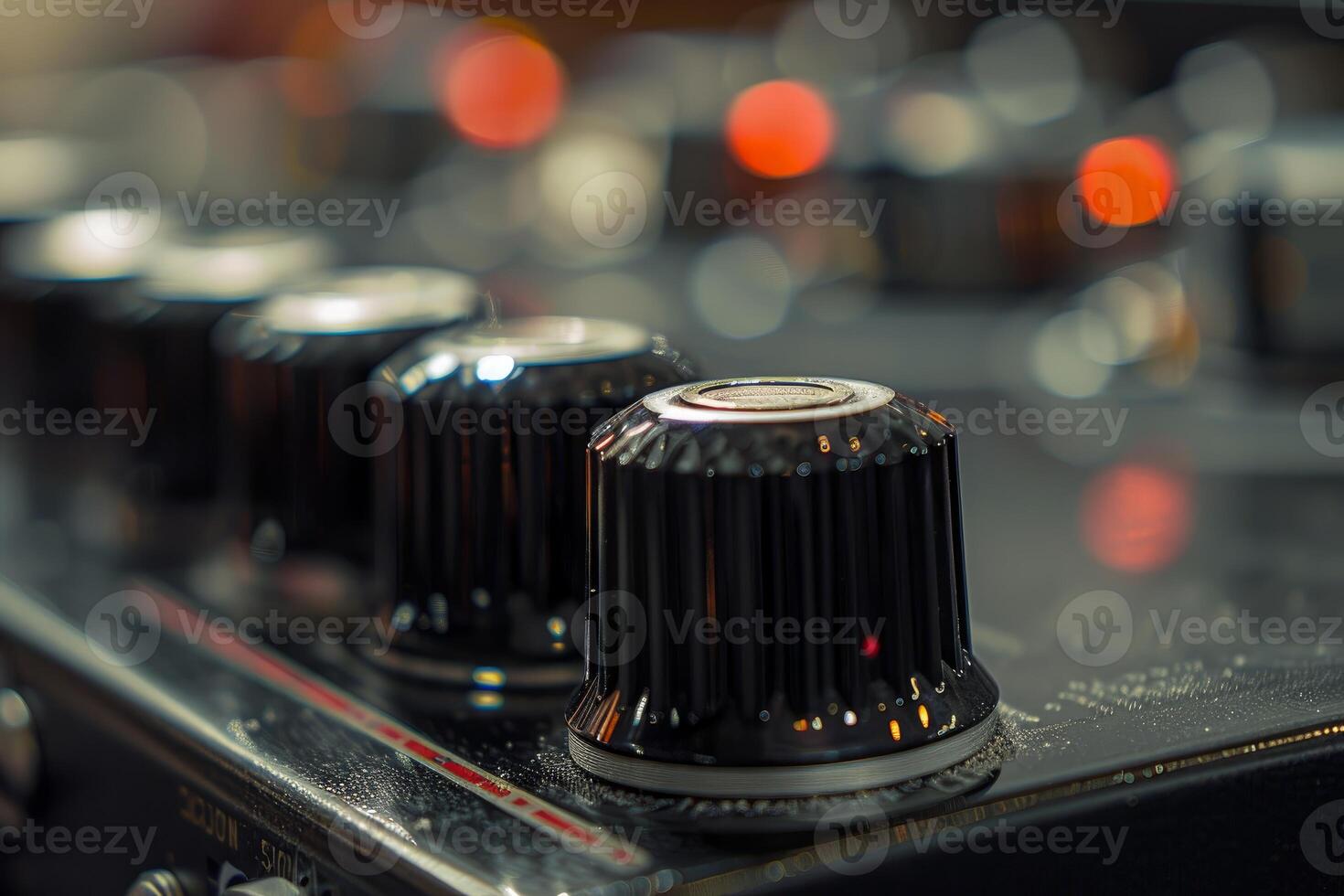 Closeup of audio mixer volume knobs photo