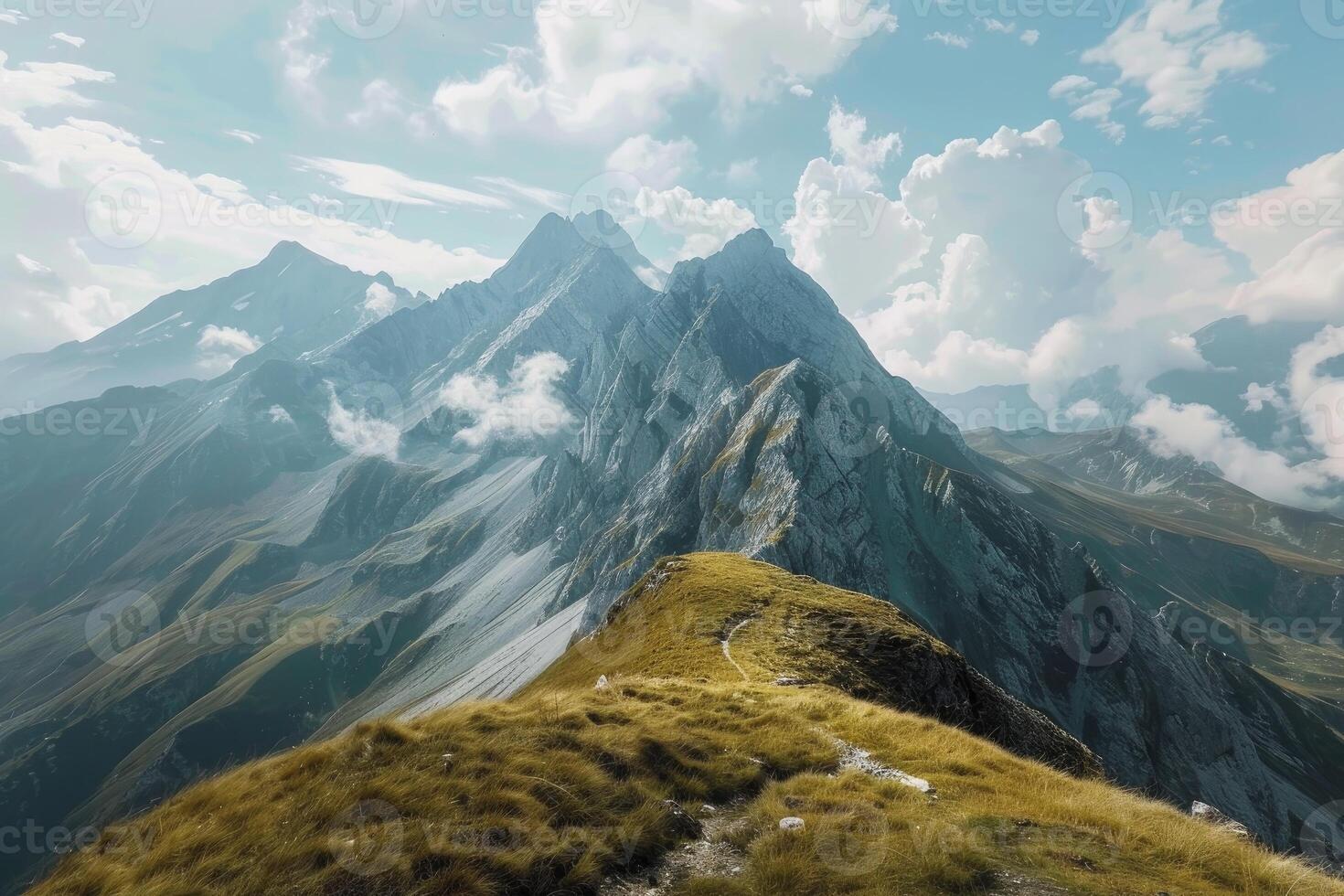 Majestic mountain peaks with clouds photo