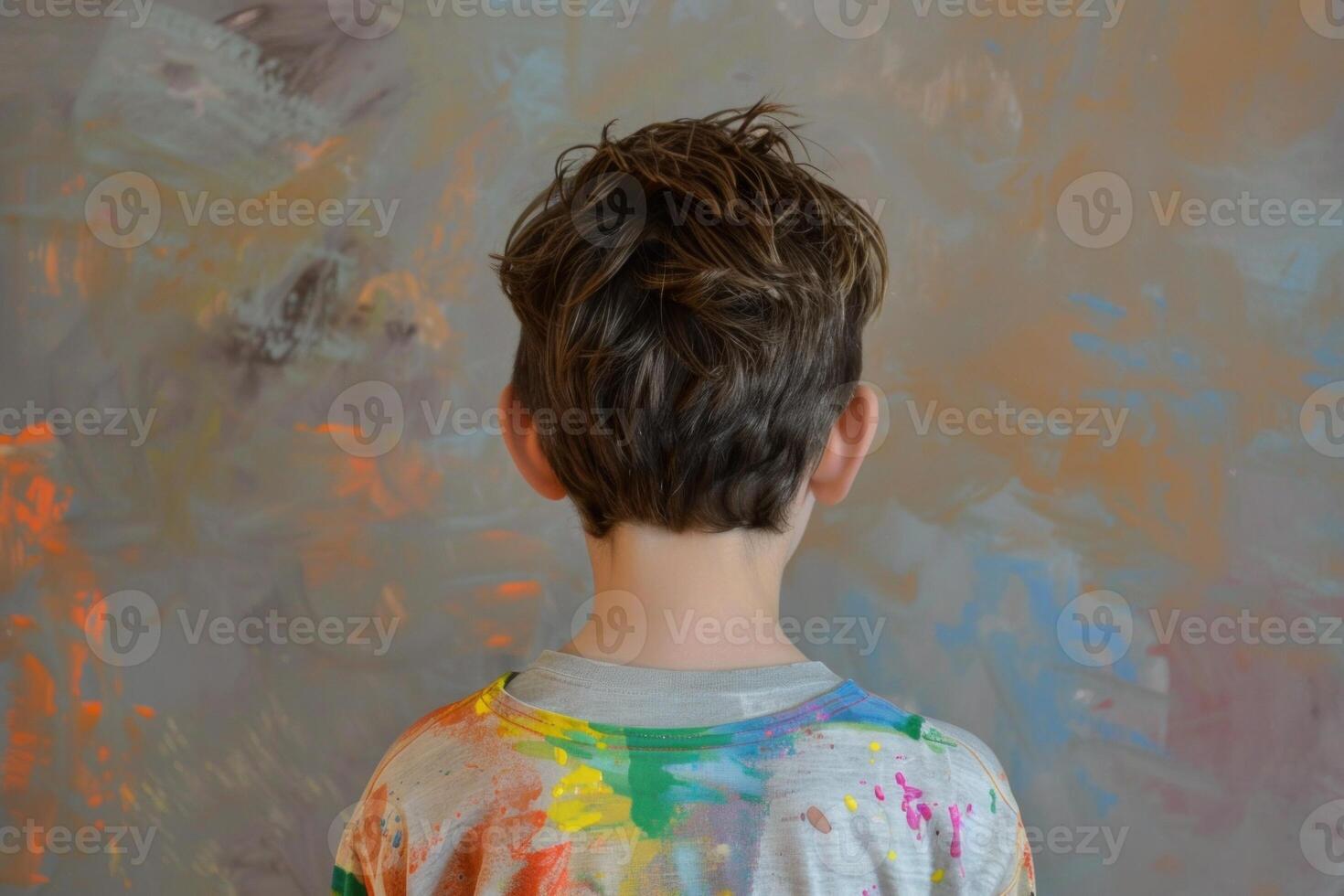 Creative child in front of painted wall photo