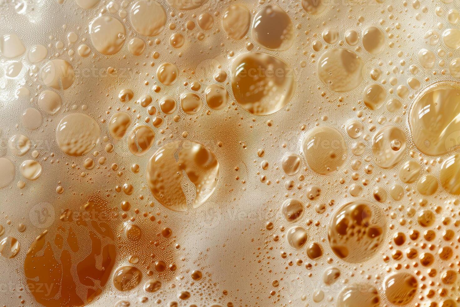 Closeup of beer bubbles forming a background of liquid photo