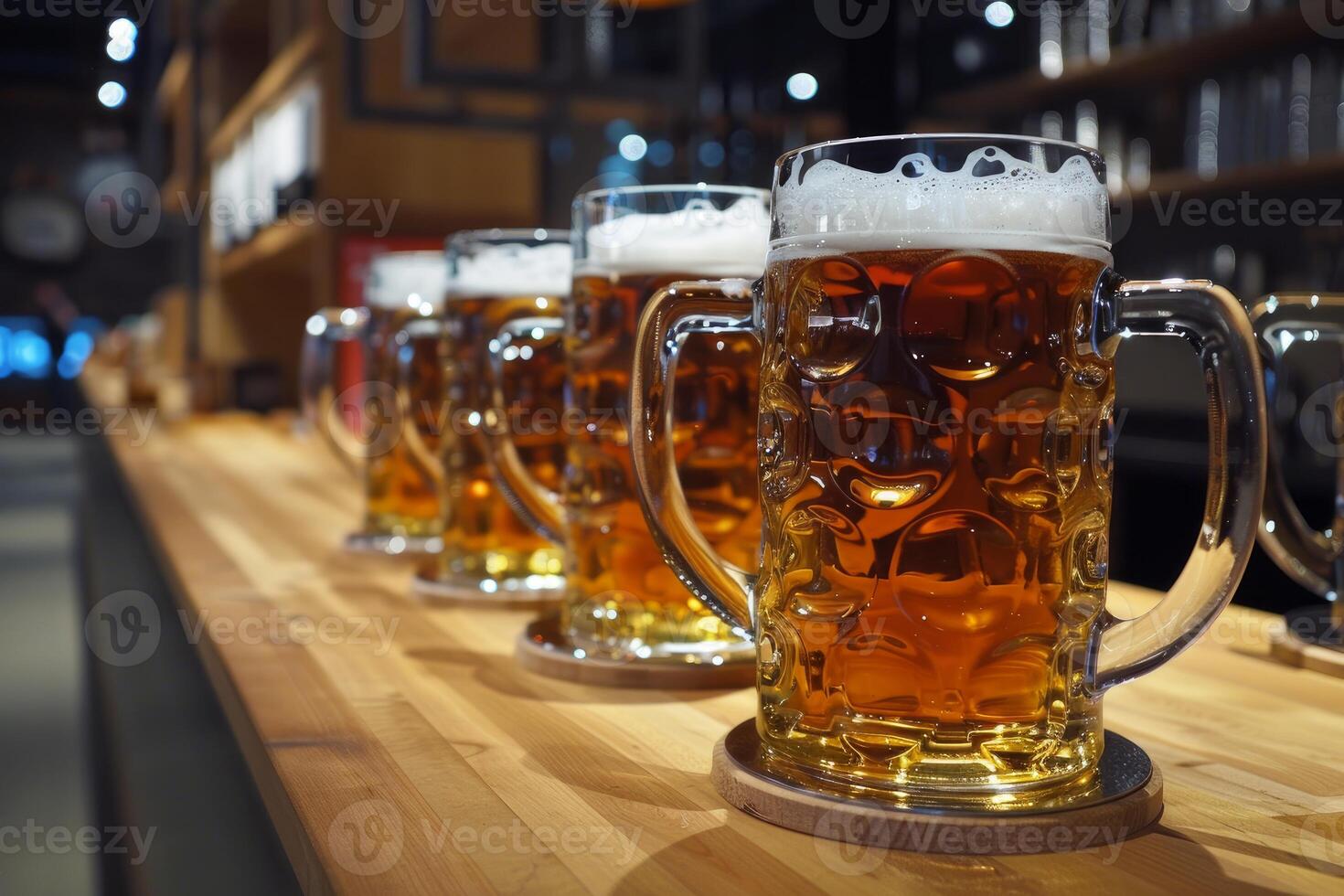 Row of full beer mugs standing on bar counter in a pub photo