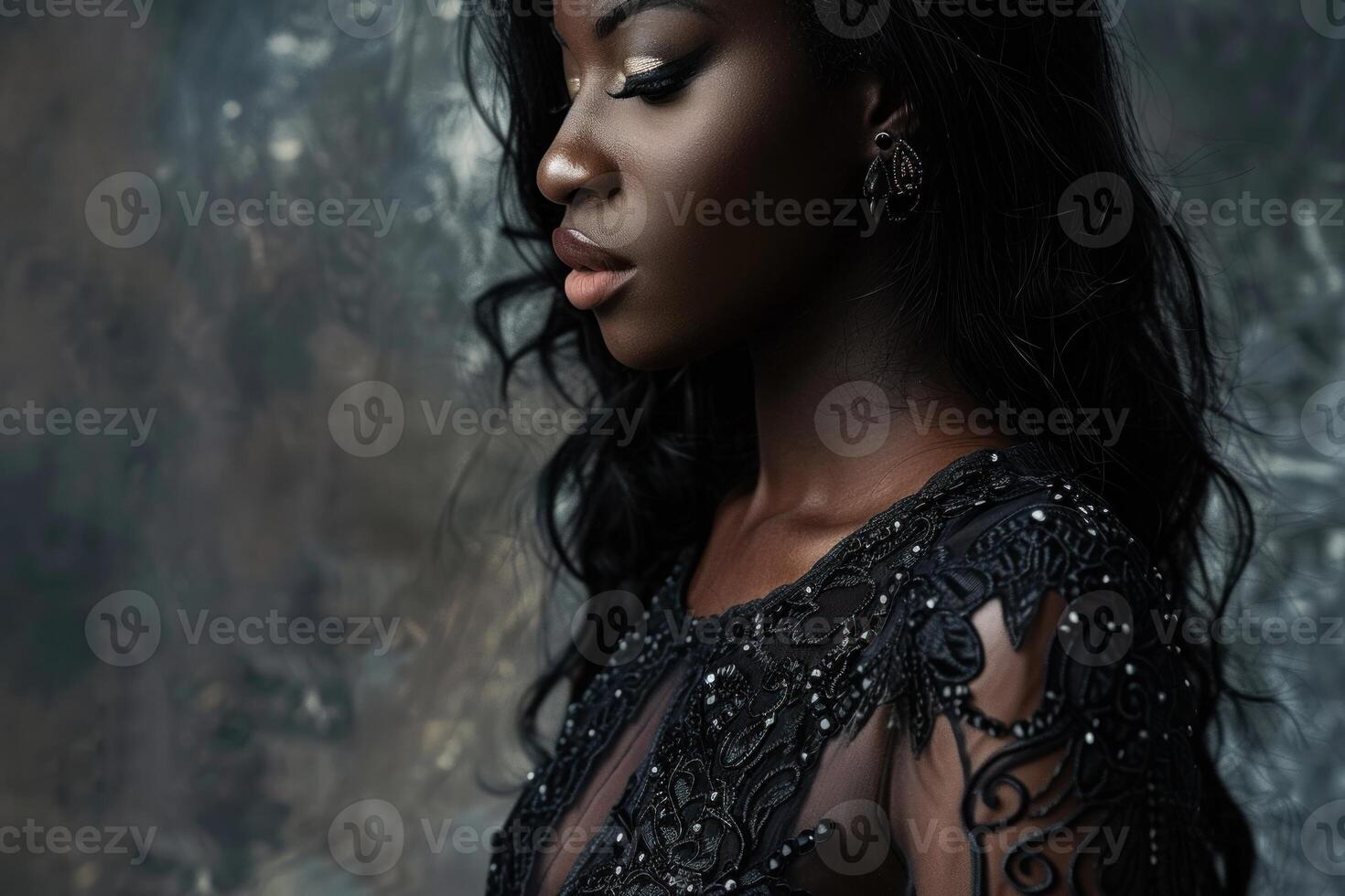Fashion model posing in elegant black dress with lace details photo