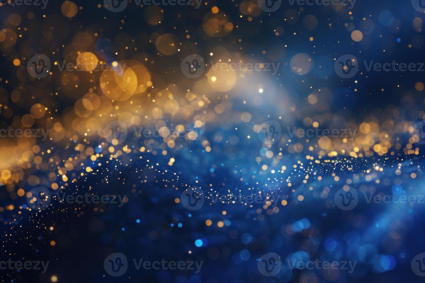 Abstract gold and blue defocused lights creating festive bokeh background photo