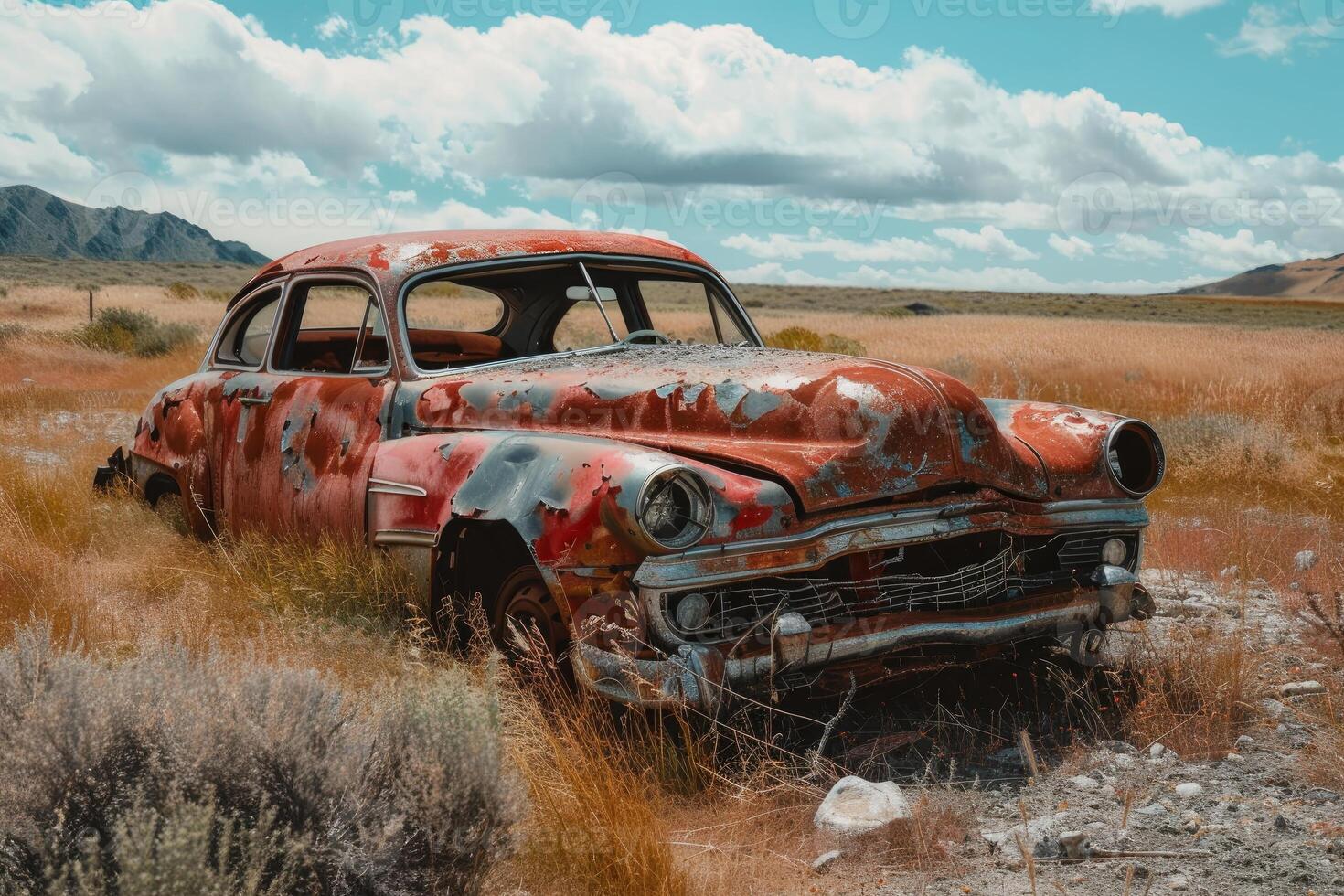 Rusty abandoned car rusting away in desert landscape photo