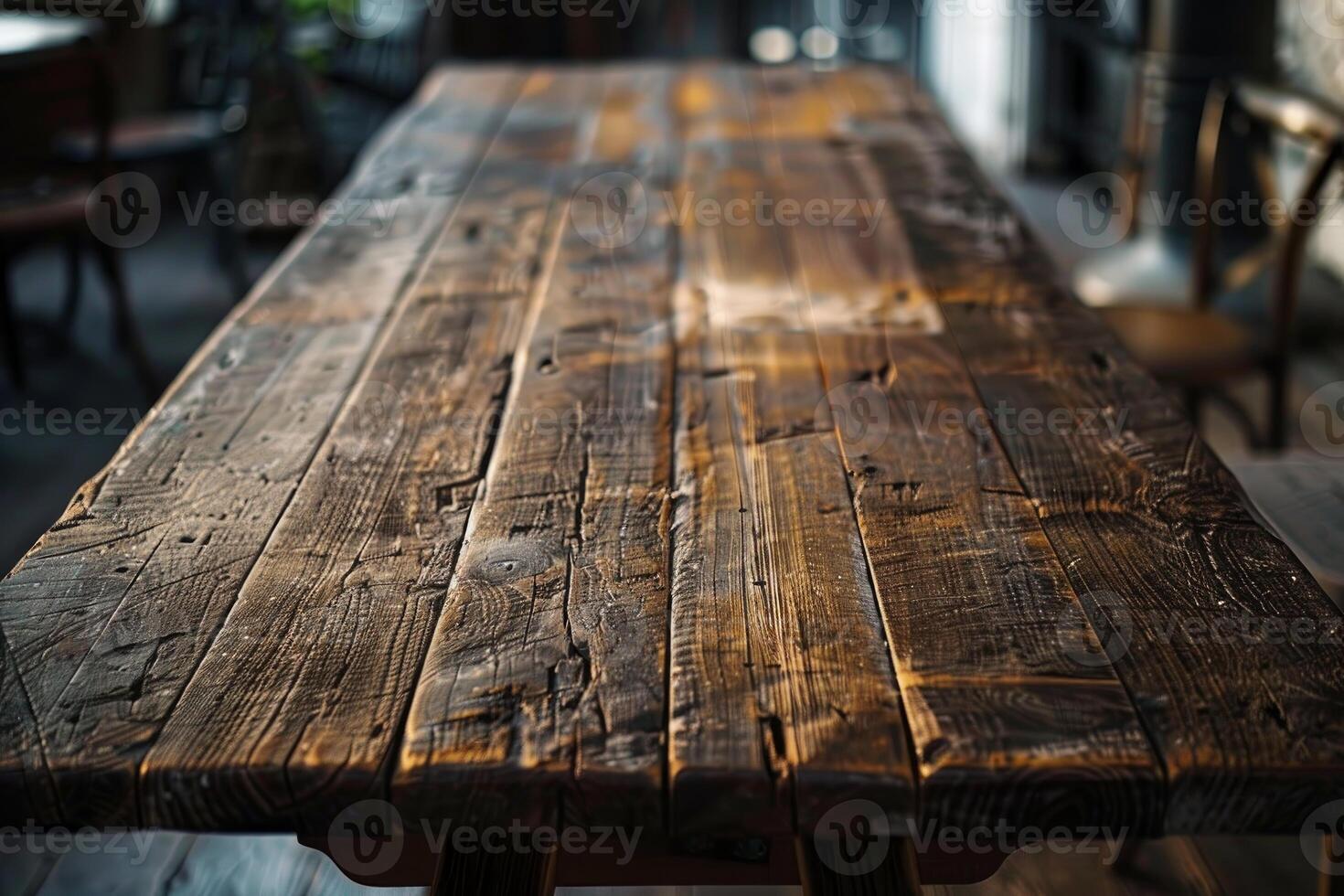 Empty rustic wooden table taking center stage in a blurred restaurant photo