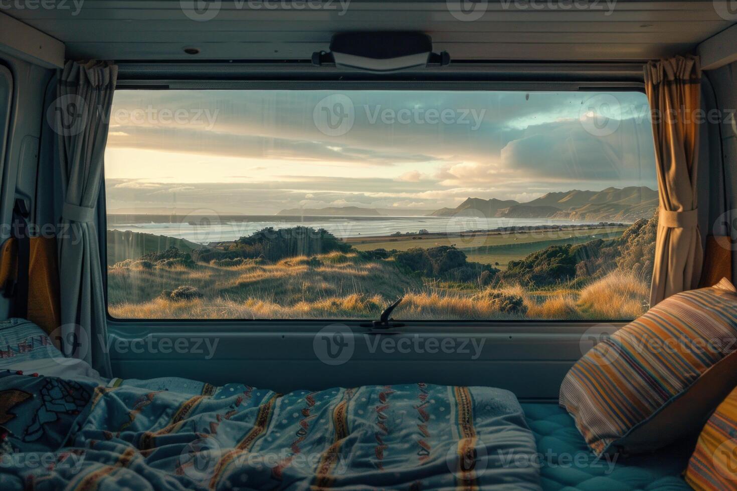 Waking up in a camper van facing a beautiful ocean view at sunset photo