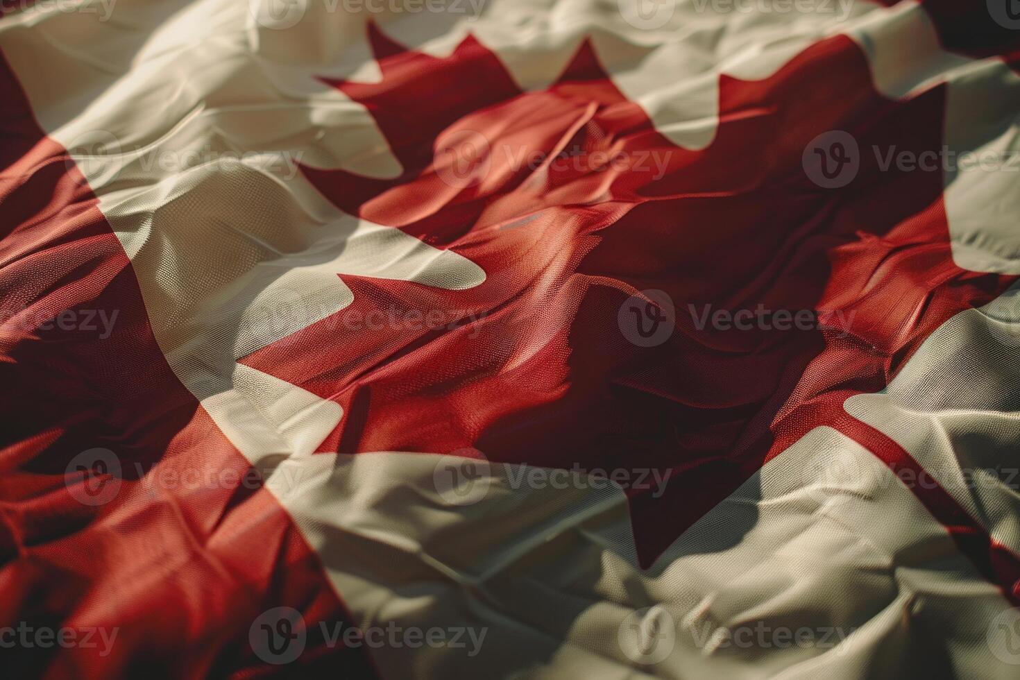 The national flag of canada is waving in the wind photo