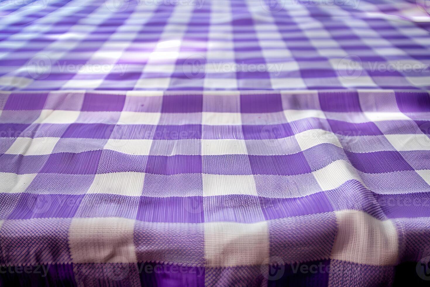 Purple gingham tablecloth forming wavy surface photo