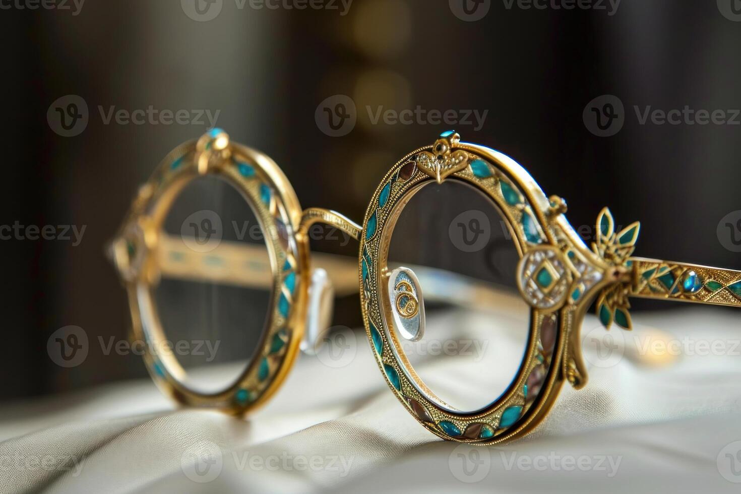 Vintage ornate eyeglasses on silk fabric photo