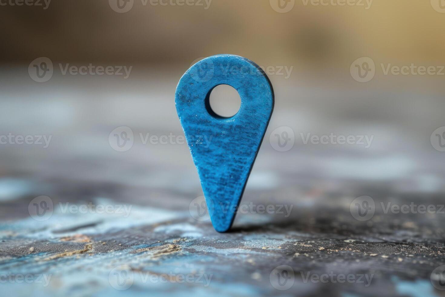 Blue map pin icon on textured surface photo