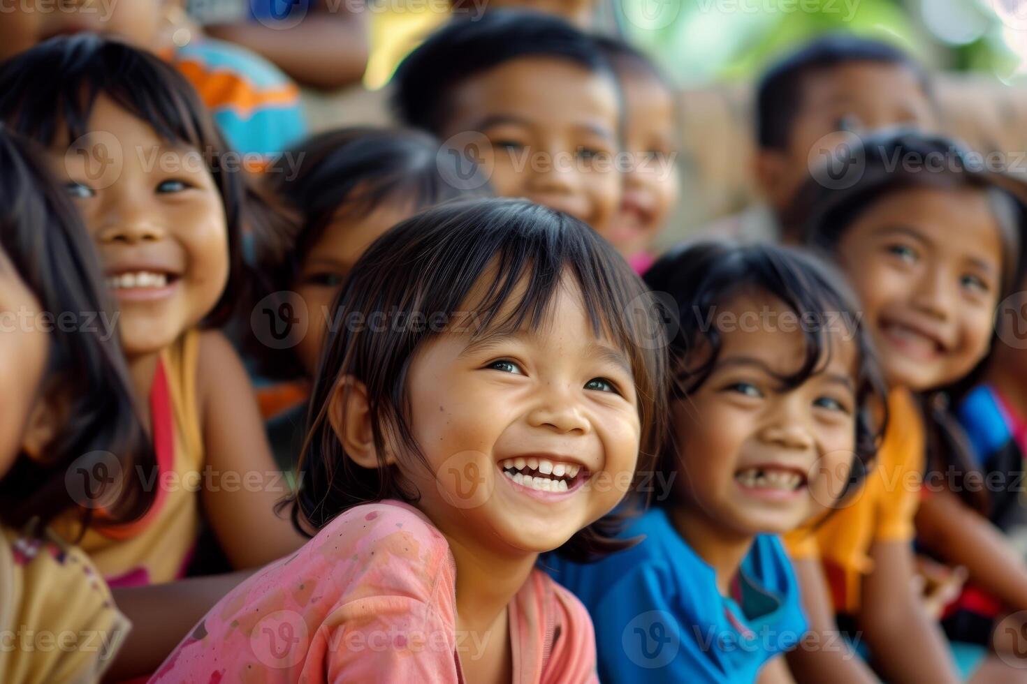 Joyful children laughing together outdoors photo
