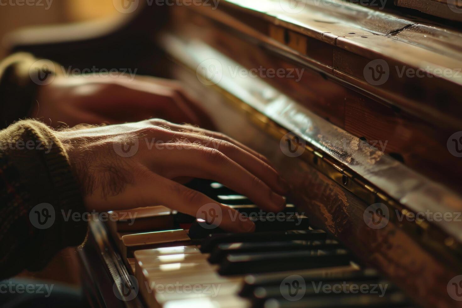 Hands playing on vintage piano keys photo