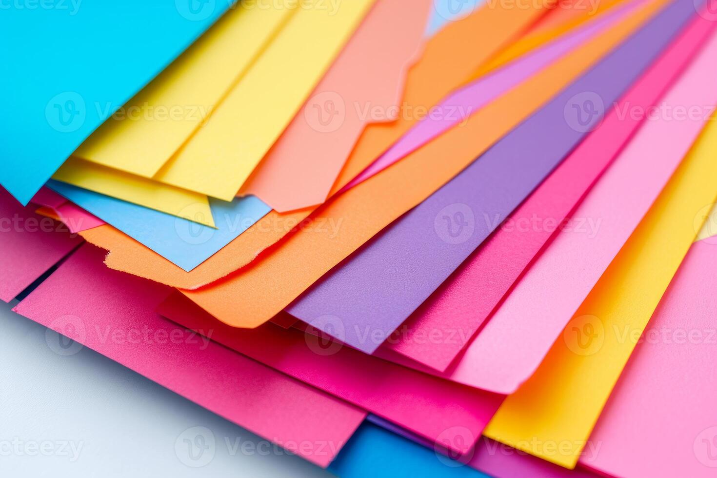 Vibrant paper assortment on gradient background photo