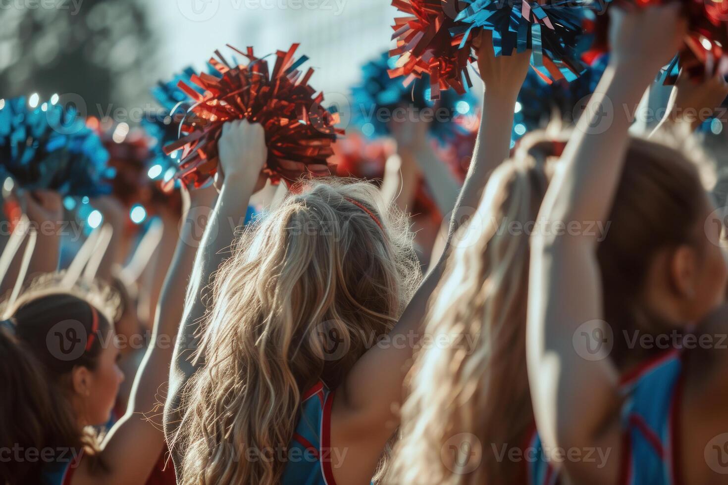 Cheerleading squad performing at sunset photo