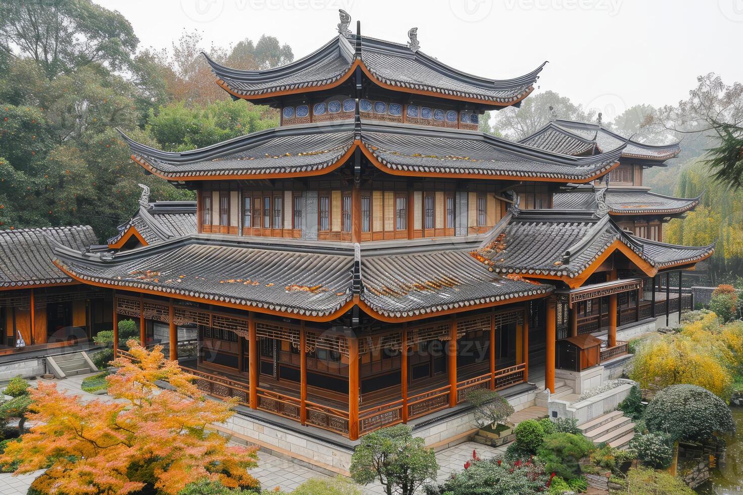 Traditional chinese architecture amidst autumn foliage photo