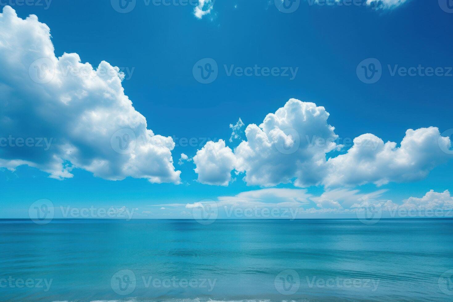 Serene blue seascape with fluffy clouds photo