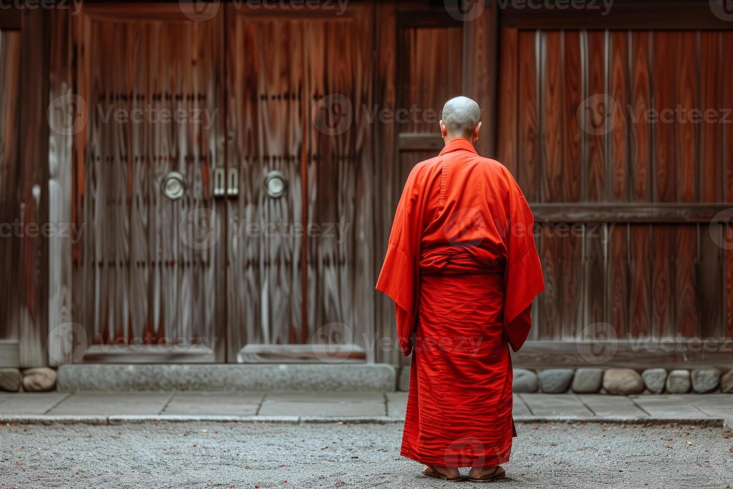 Serene monk in traditional robes at temple photo