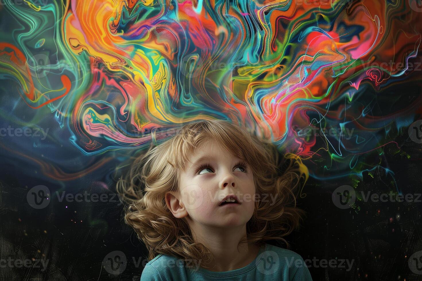 Young child looking up with awe at vibrant abstract colors signifying creativity and imagination photo