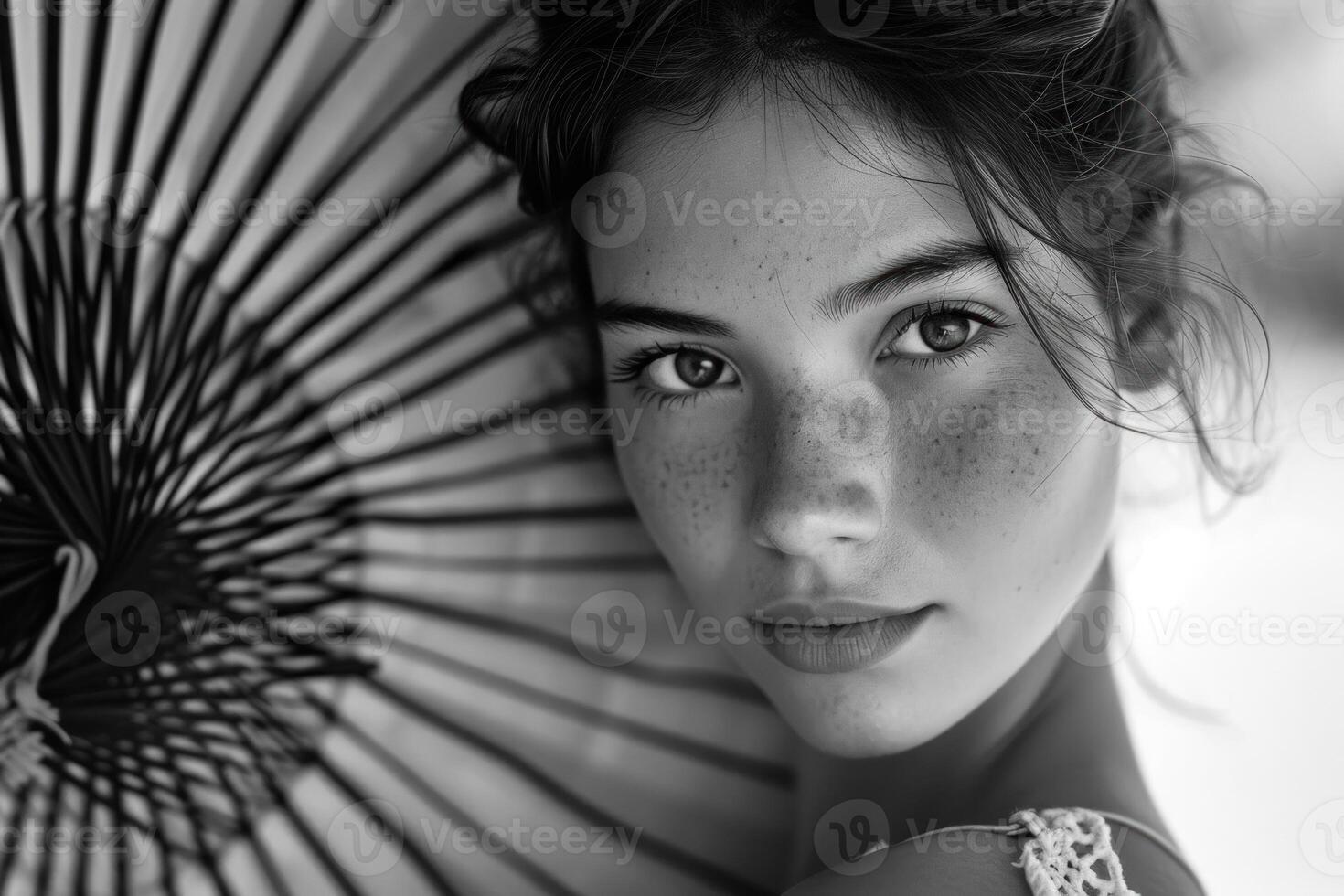 Elegant woman with parasol in monochrome photo