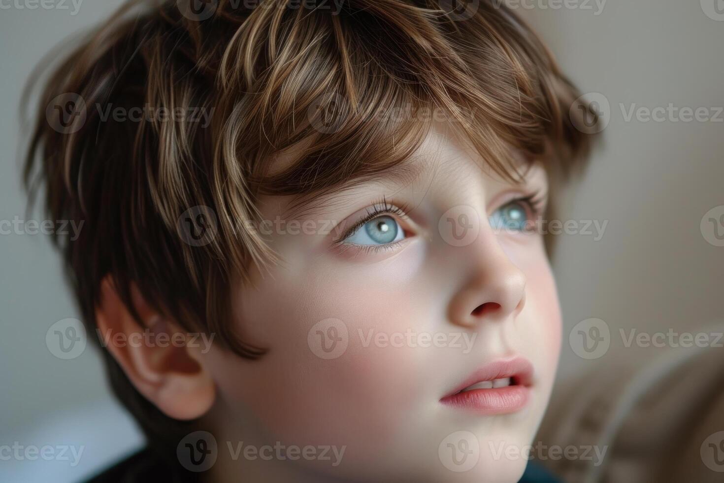Pensive child gazing into distance photo