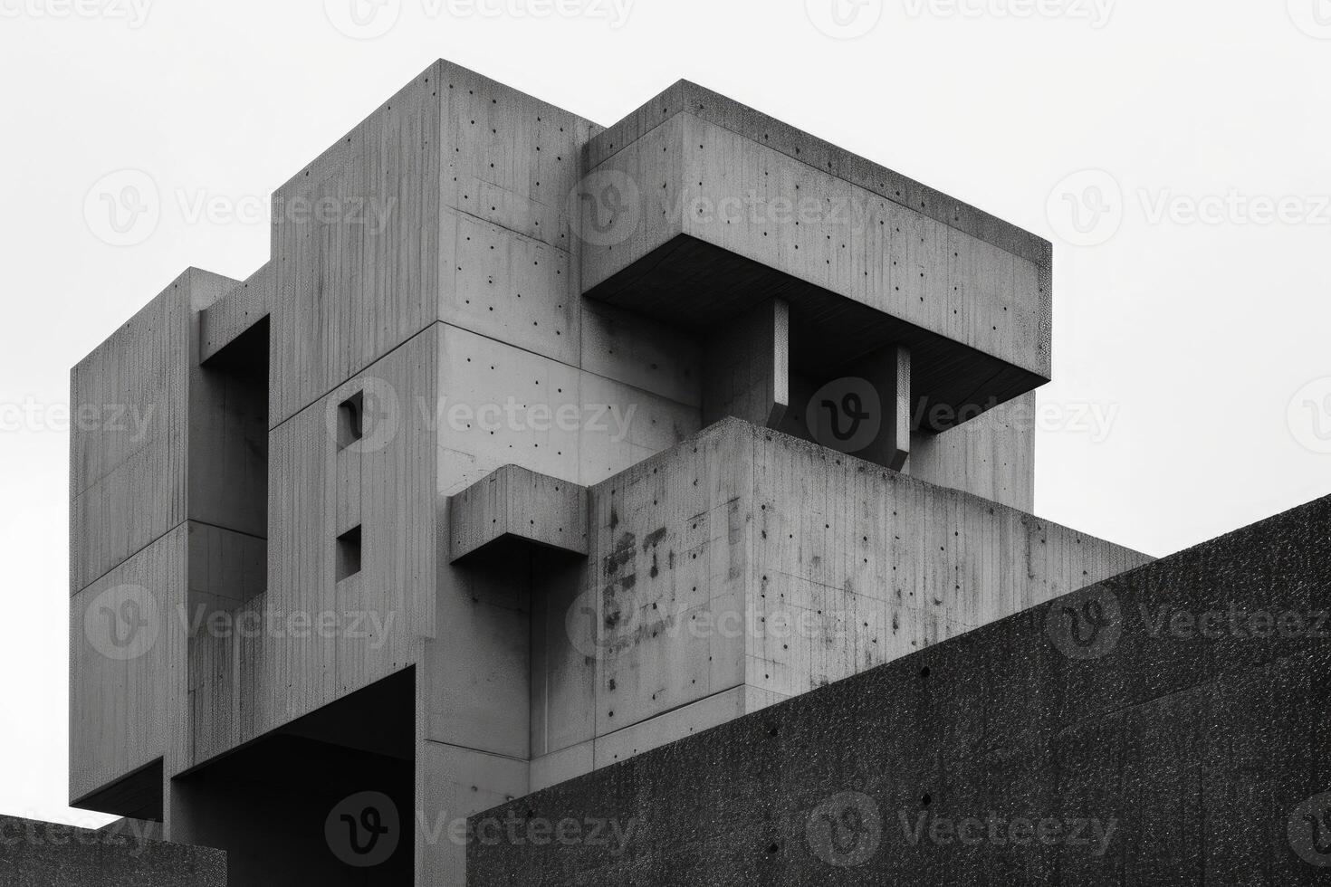 Black and white photo of a concrete brutalist structure with strong geometric shapes