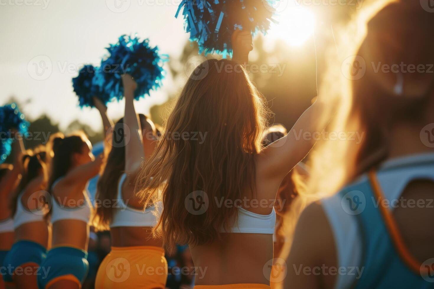 Cheerleading squad in sunset performance photo
