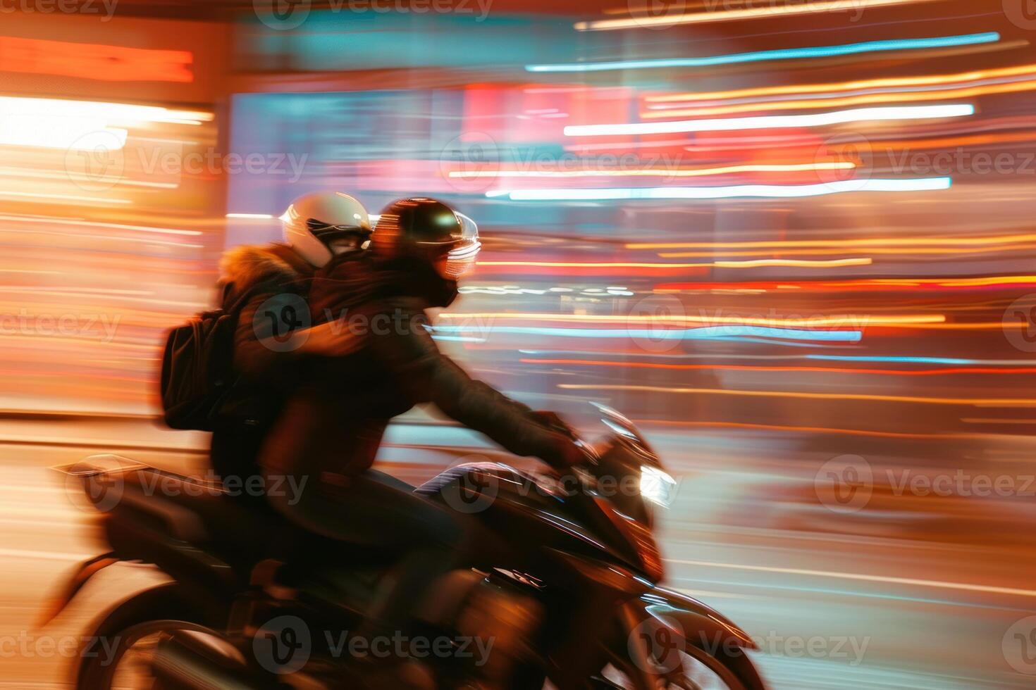 Speeding motorcycle in urban nightlife photo