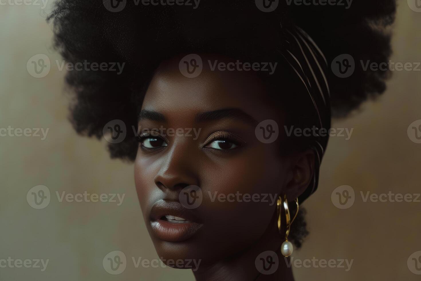 Elegant afro woman with statement earrings photo