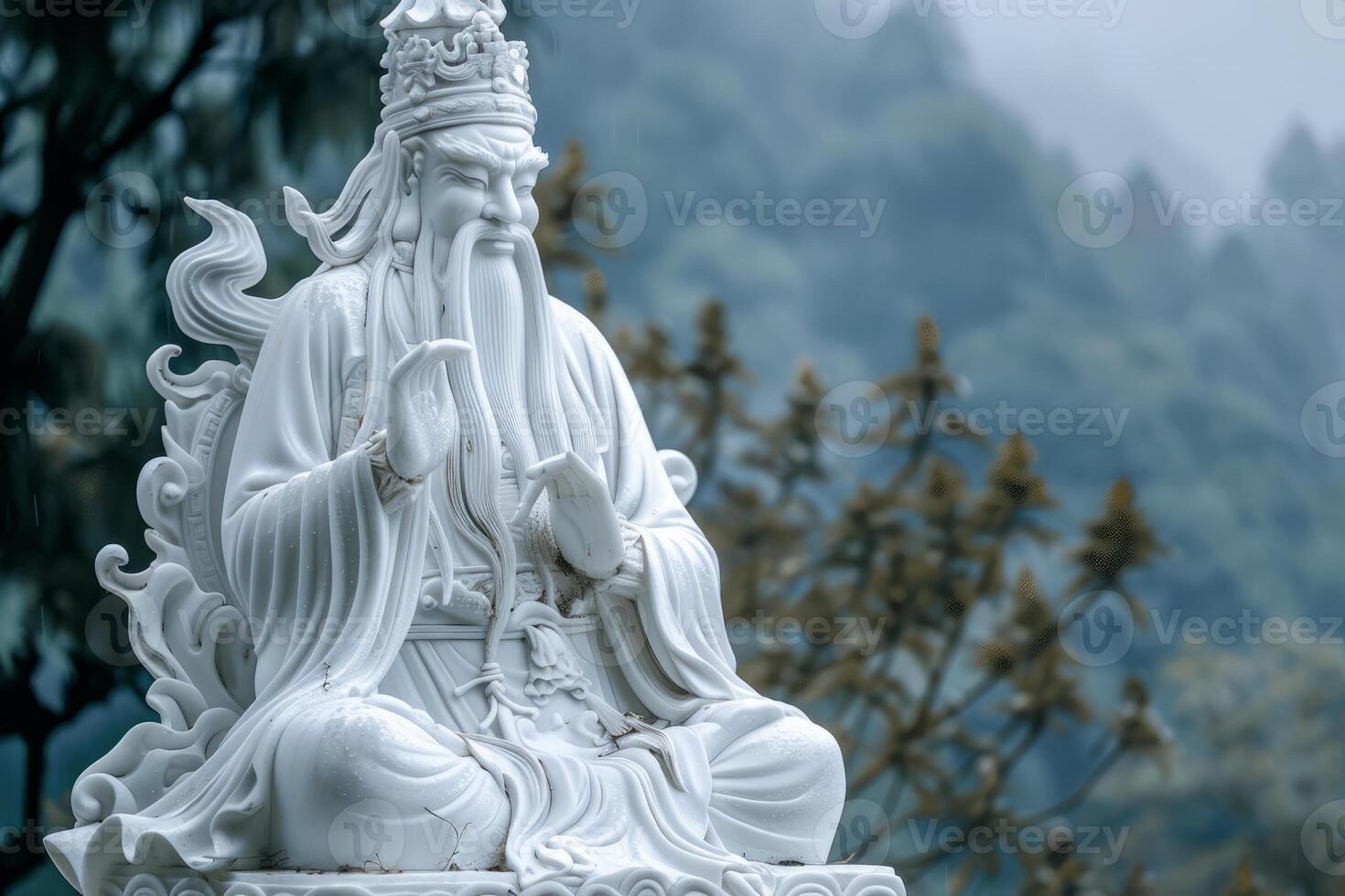 Serene white marble guan yu statue against misty background photo