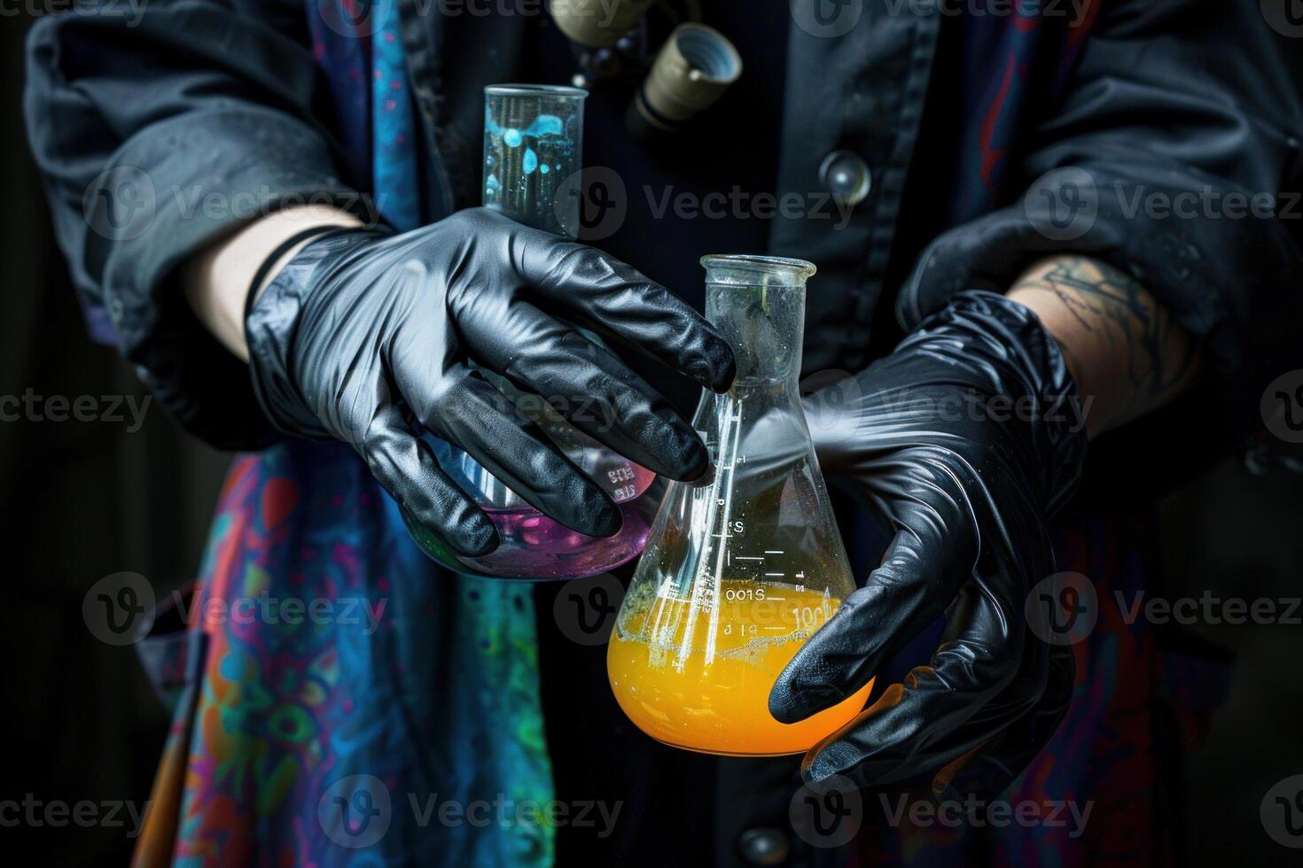 Scientist holding chemical flasks in laboratory photo