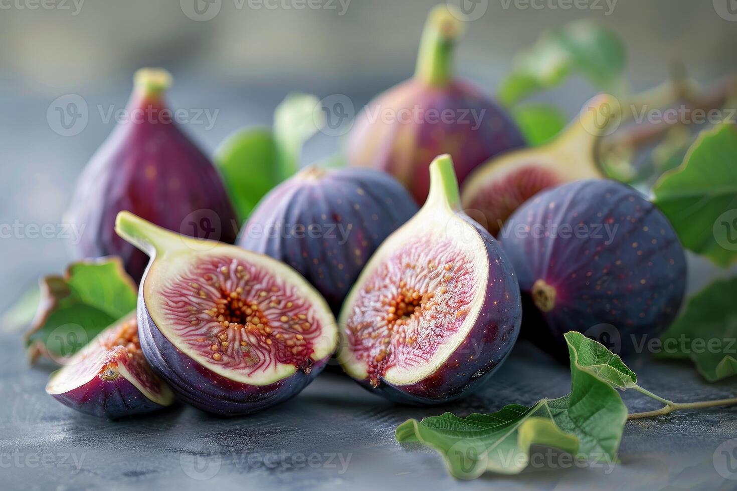 Fresh figs display on textured surface photo