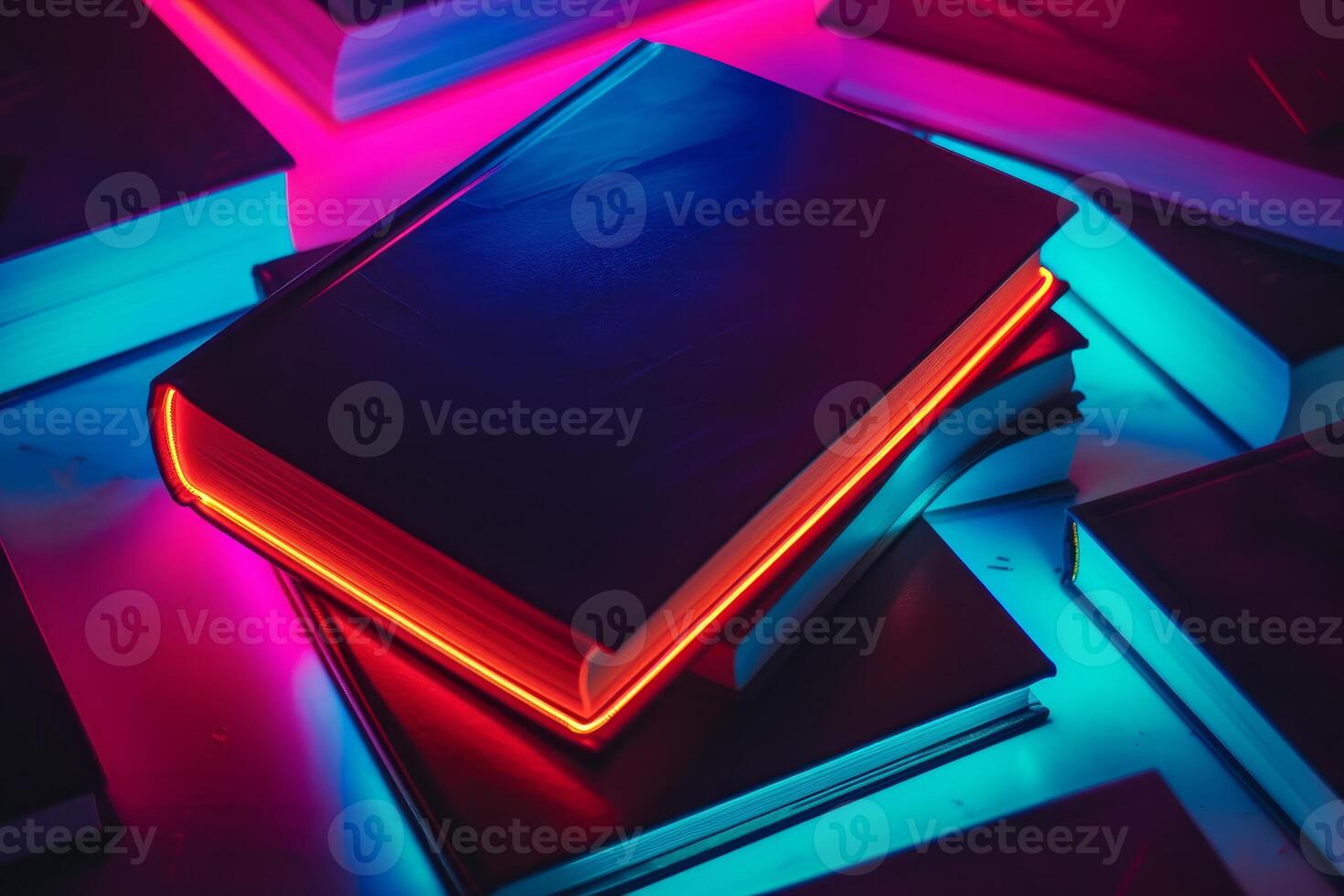 Neon glow illuminating stack of books in dark photo