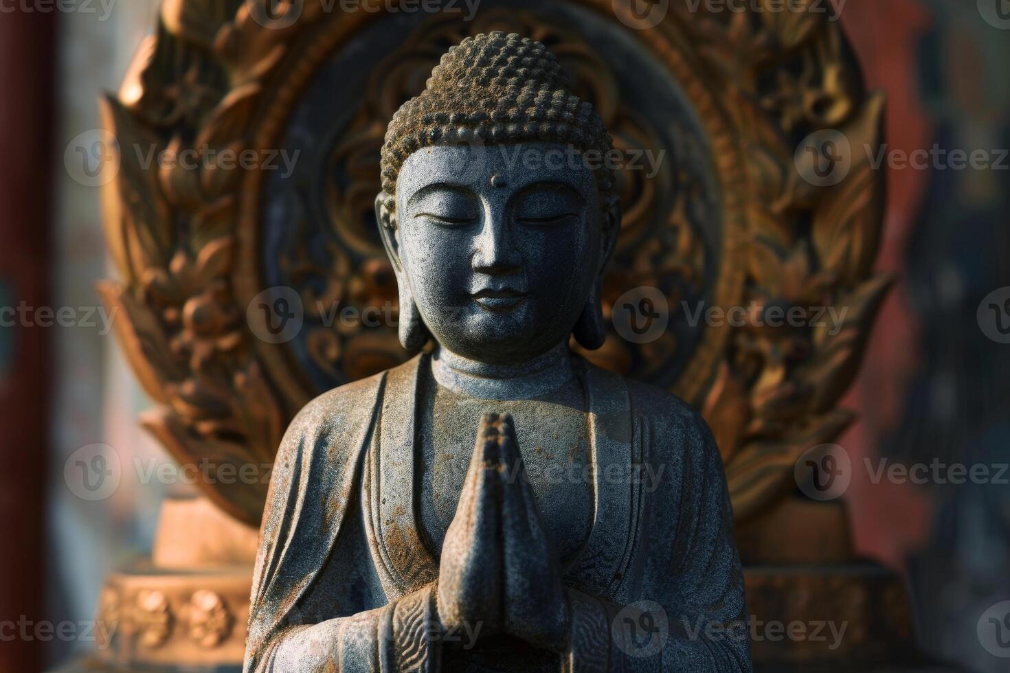 Serene buddha statue in prayer pose photo