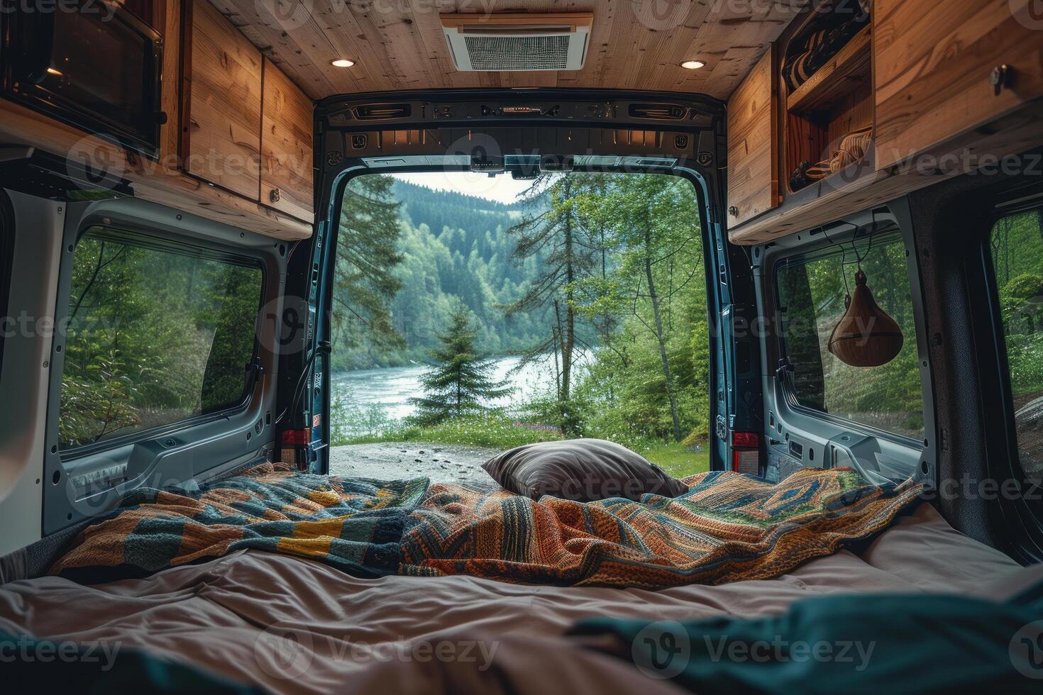 Cozy camper van interior with nature view photo