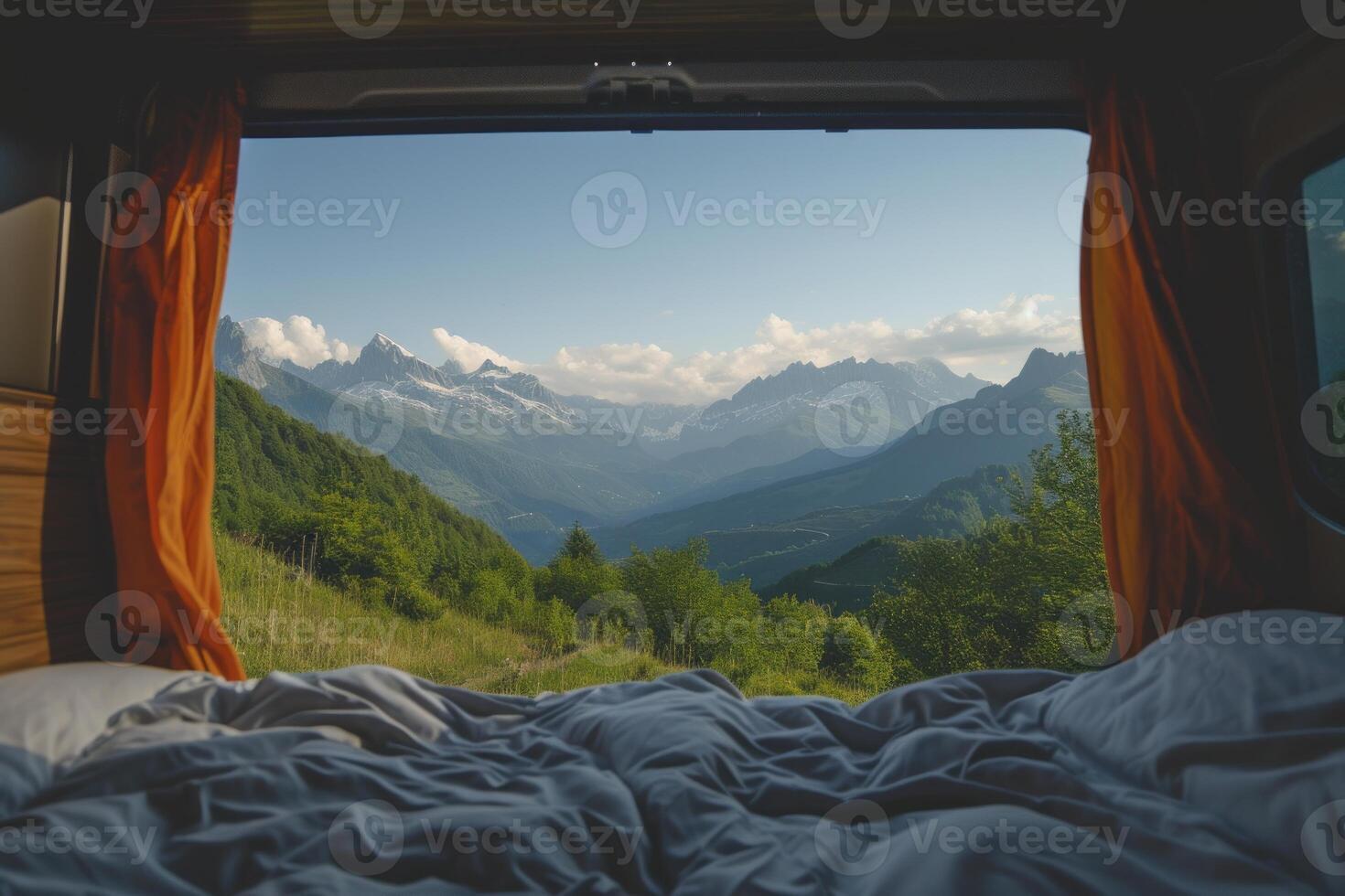 Vanlife mountain view from cozy camper bed photo