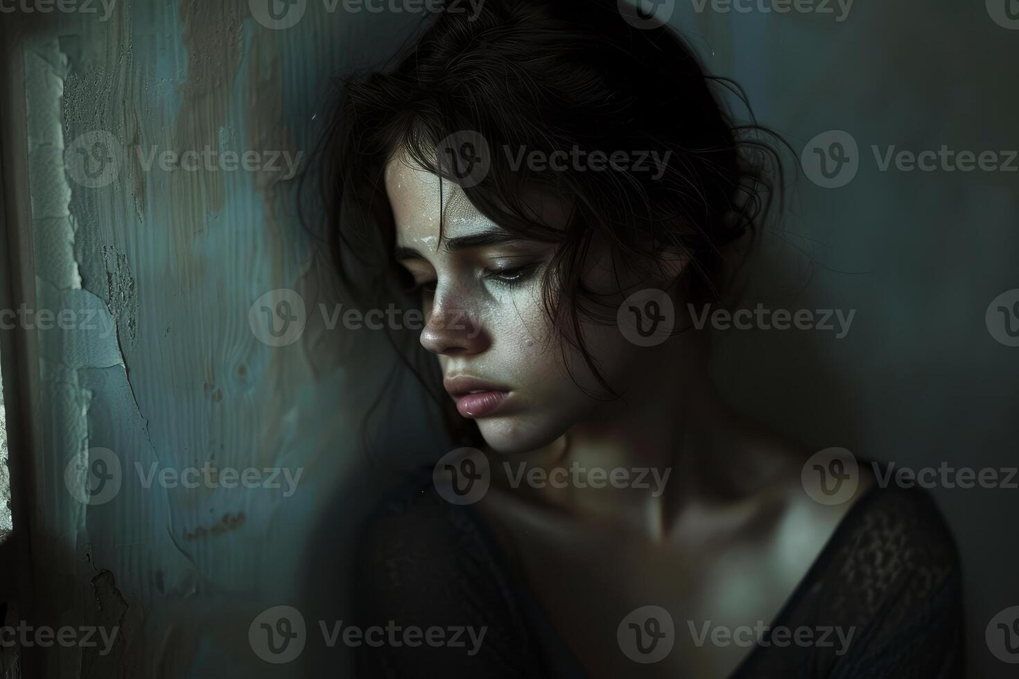 Solitude and grief portrait in dim light photo