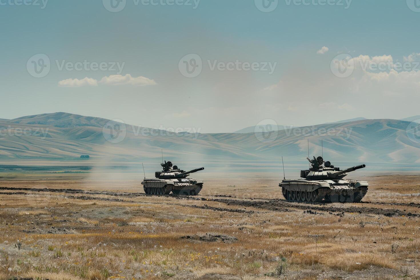 Military tanks maneuvering in desert terrain photo