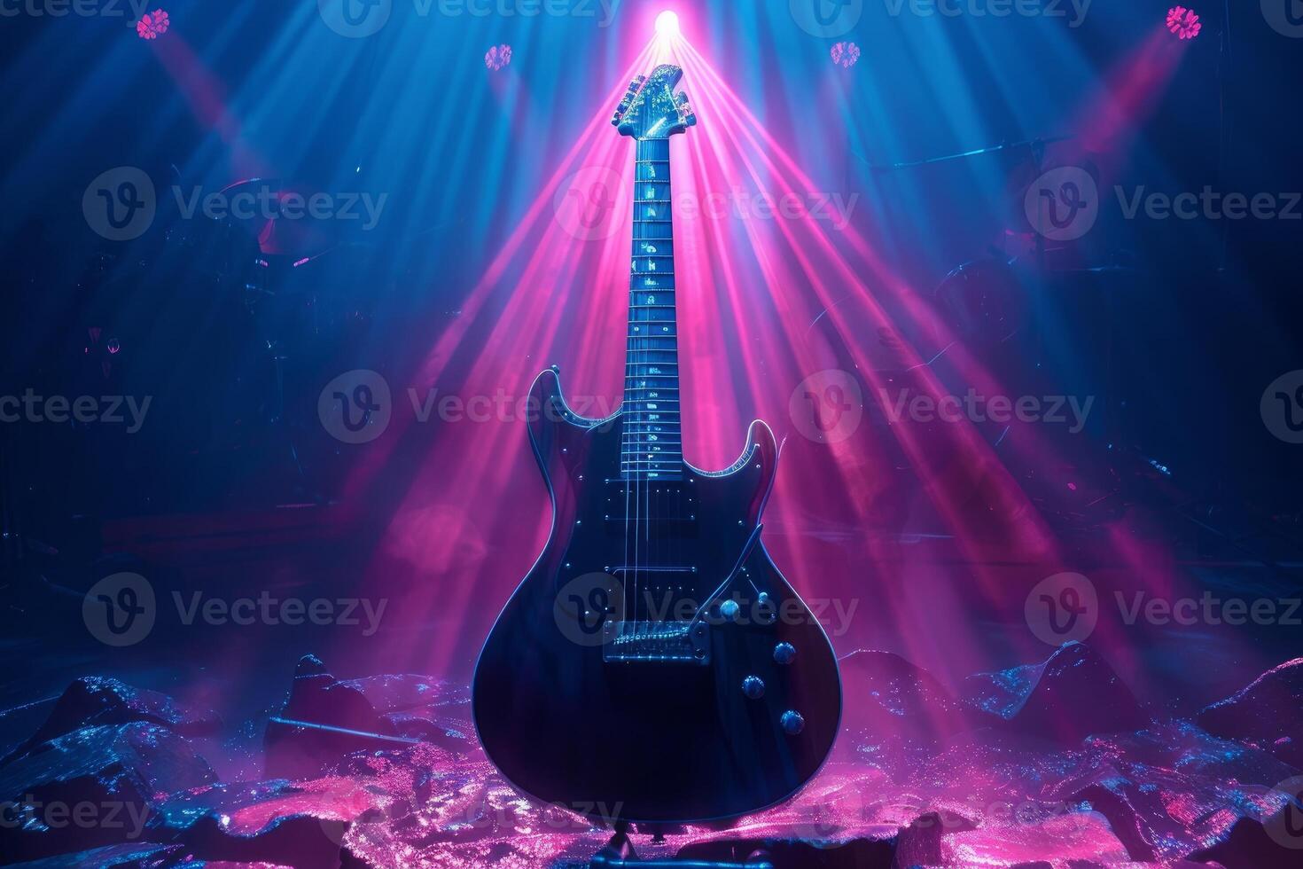 Electric guitar on stage with vibrant neon lights photo
