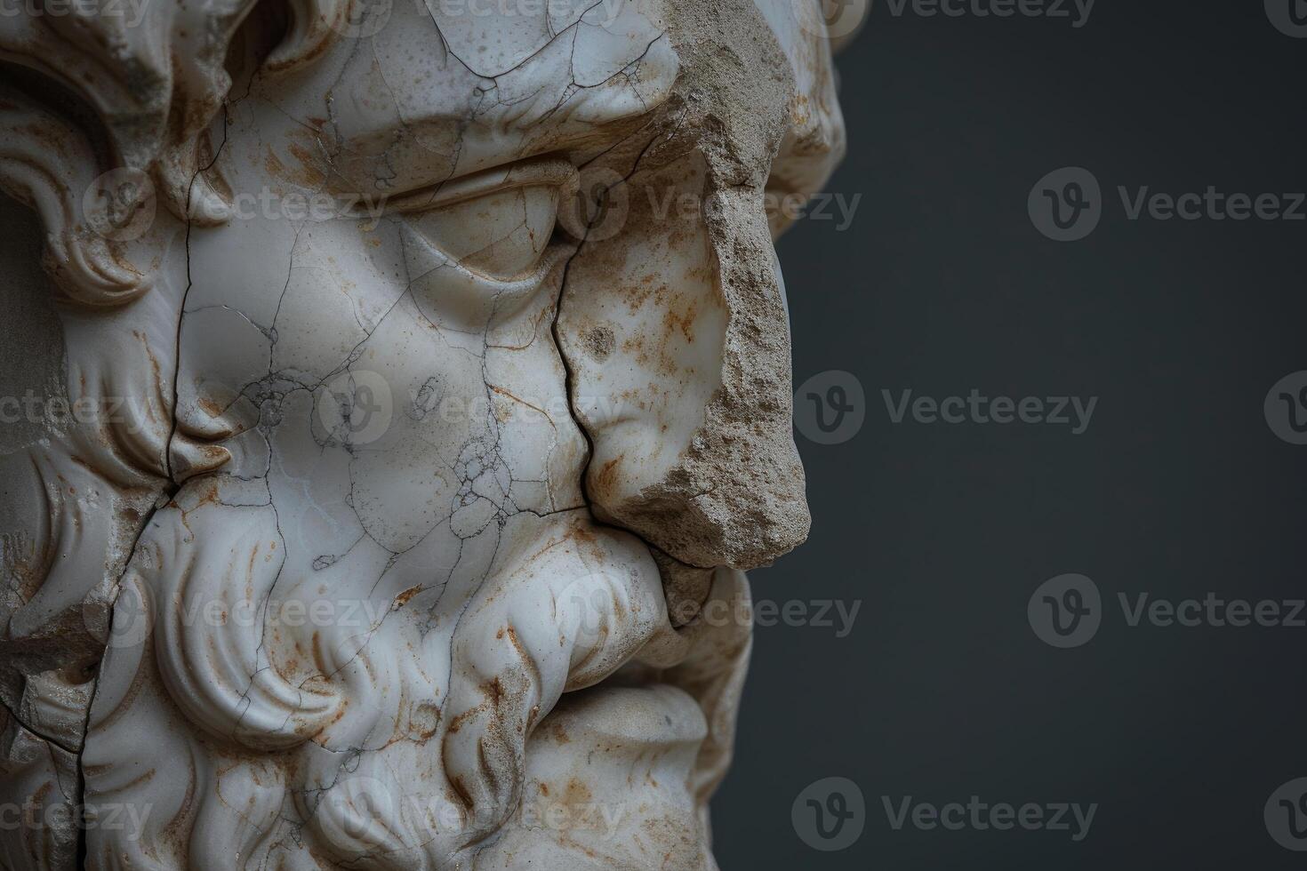 Close-up of a weathered marble bust, showcasing intricate carving details and texture photo