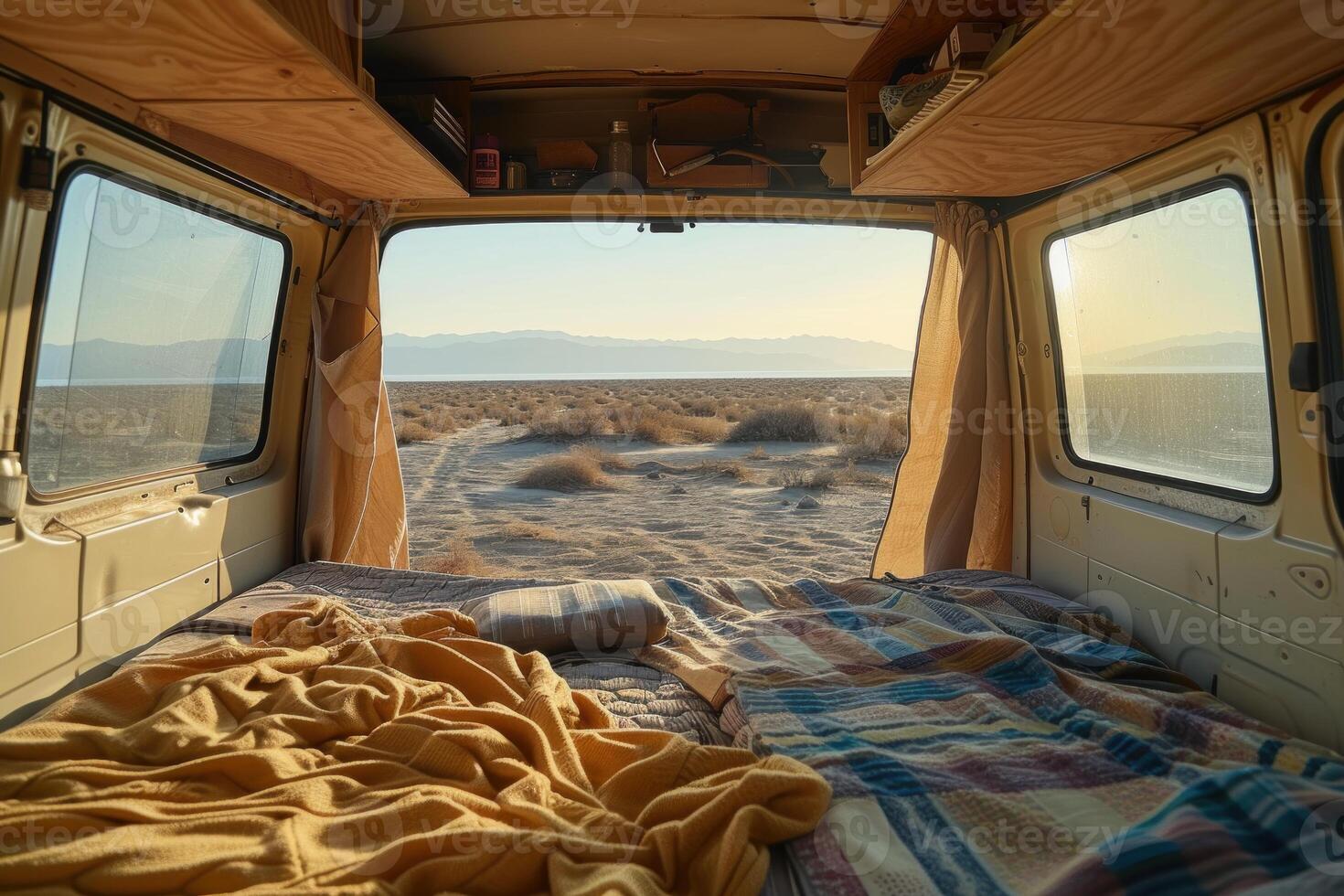 Van life adventure - desert sunrise view from cozy camper photo