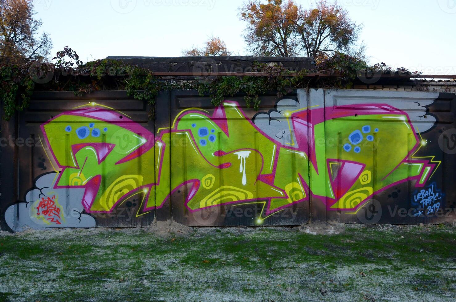 Colorful background of graffiti painting artwork with bright aerosol outlines on wall. Old school street art piece made with aerosol spray paint cans. Contemporary youth culture photo